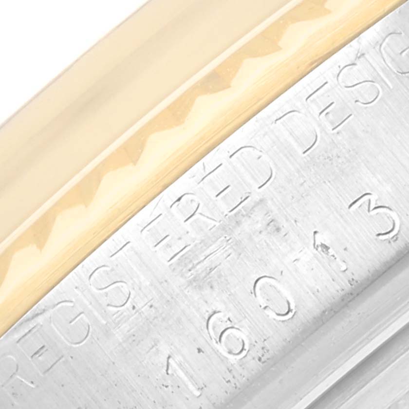 This close-up image shows the case side and part of the bezel of a Rolex Vintage Collection 16013 Men's Steel and Gold (two tone) Champagne Dial 16013 Men's Steel and Gold (two tone) Champagne Dial watch with visible engraving.