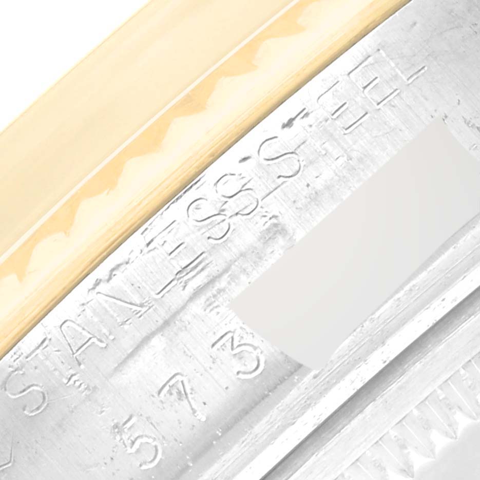 This image is a close-up of the side of the Rolex Vintage Collection 16013 Men's Steel and Gold (two tone) Champagne Dial 16013 Men's Steel and Gold (two tone) Champagne Dial model, showing part of the bezel and engraved details.