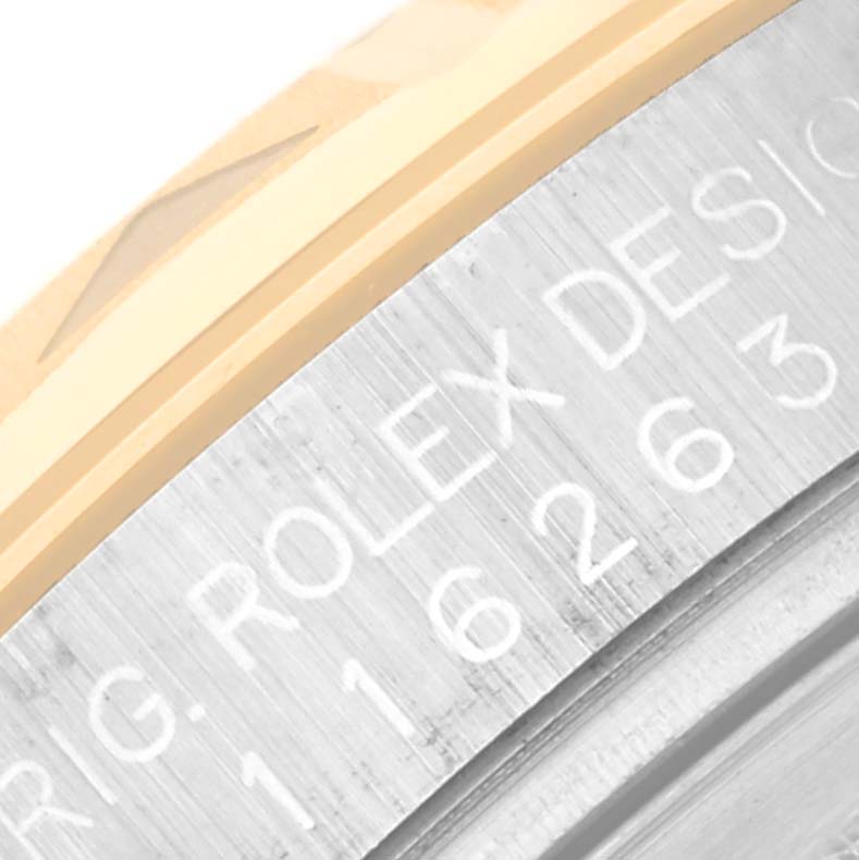 This close-up shows the side of the bezel and the case of the Rolex Turn-o-Graph 116263 Men's Steel and Gold (two tone) White Dial 116263 Men's Steel and Gold (two tone) White Dial, including the engraved model number.