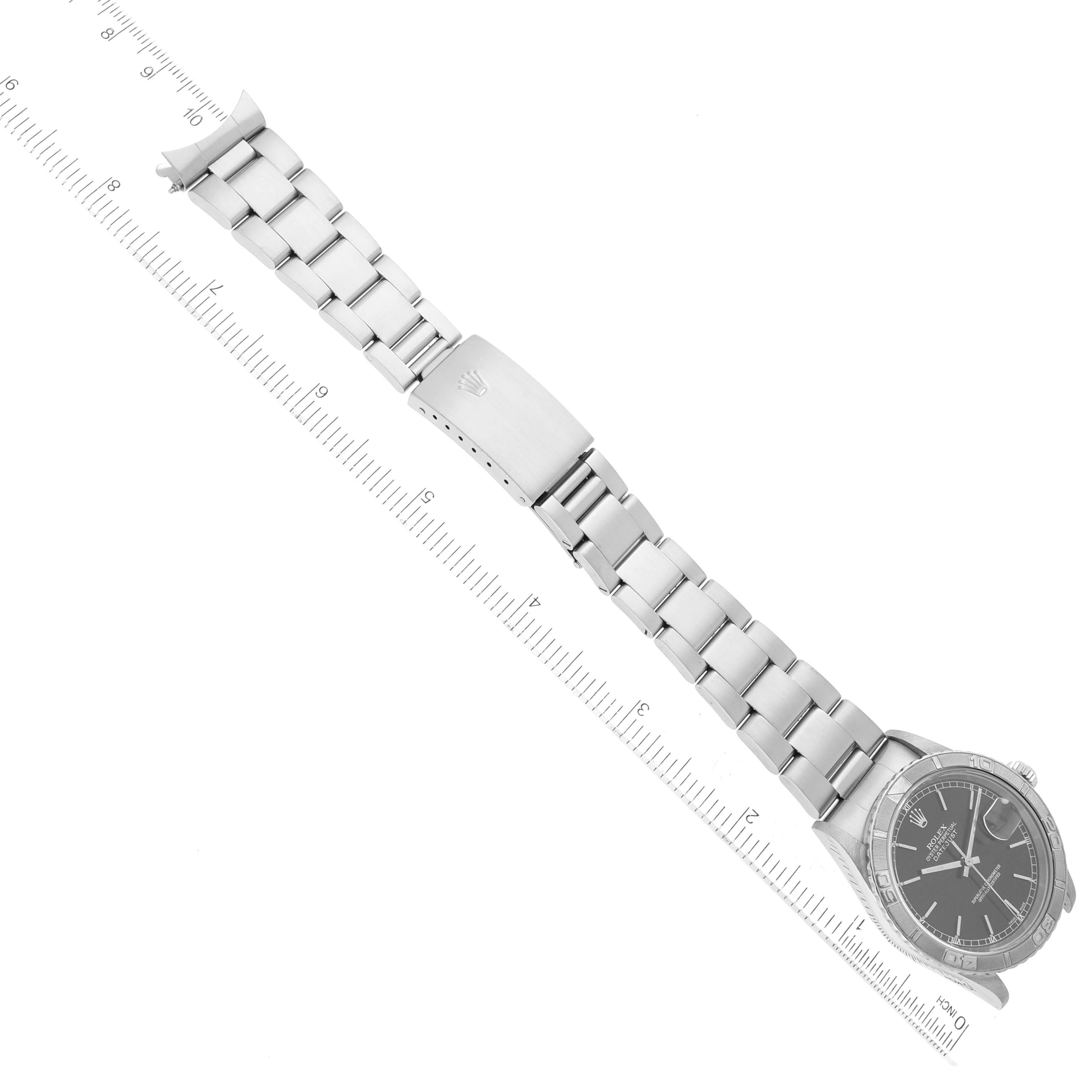 The Rolex Turn-o-Graph 16264 Men's Stainless Steel Black Dial 16264 Men's Stainless Steel Black Dial watch is shown from a top-down angle, displaying its face, bracelet, and clasp.