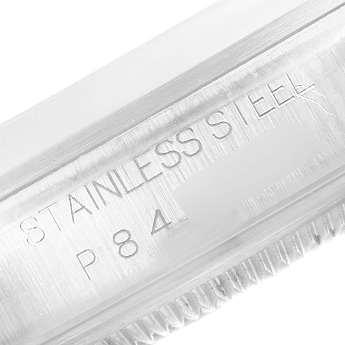 Close-up of the side of a Rolex Datejust 16200 Men's Stainless Steel White Dial 16200 Men's Stainless Steel White Dial watch, showing the stainless steel engraving and part of the bezel.