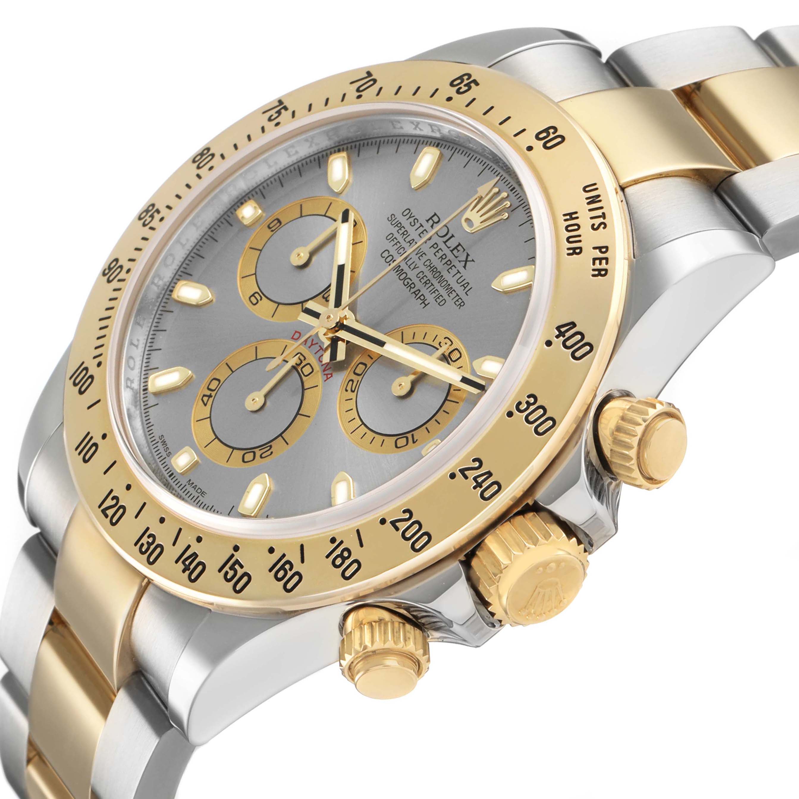 The Rolex Daytona 116523 Men's Steel and Gold (two tone) Silver Dial watch is shown at an angled close-up, highlighting its bezel, dial, crown, and pushers.