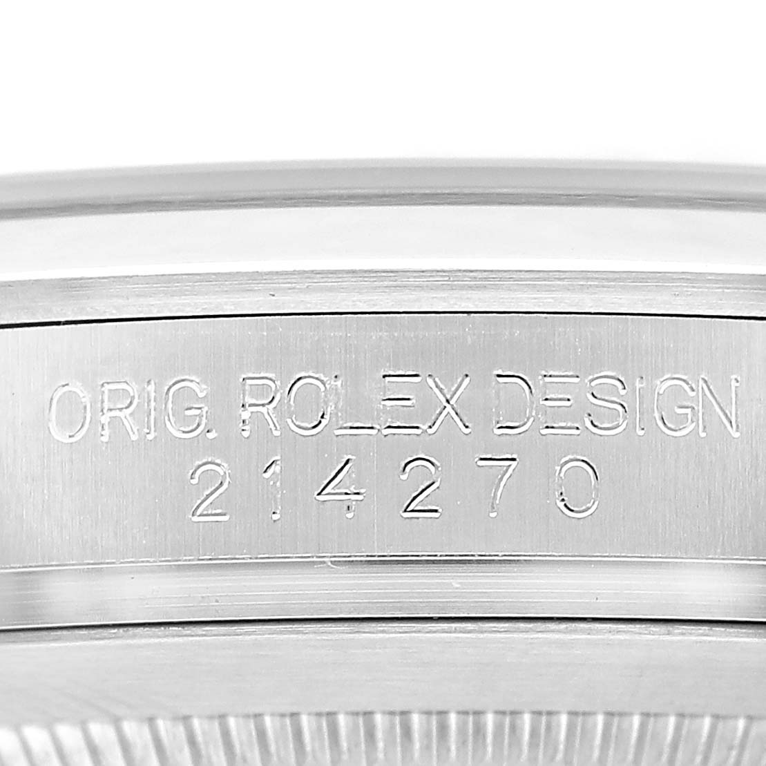 The image shows a close-up of the side of a Rolex Explorer 214270 Men's Stainless Steel Black Dial watch, highlighting the engraved model number "214270" and "ORIG. ROLEX DESIGN."