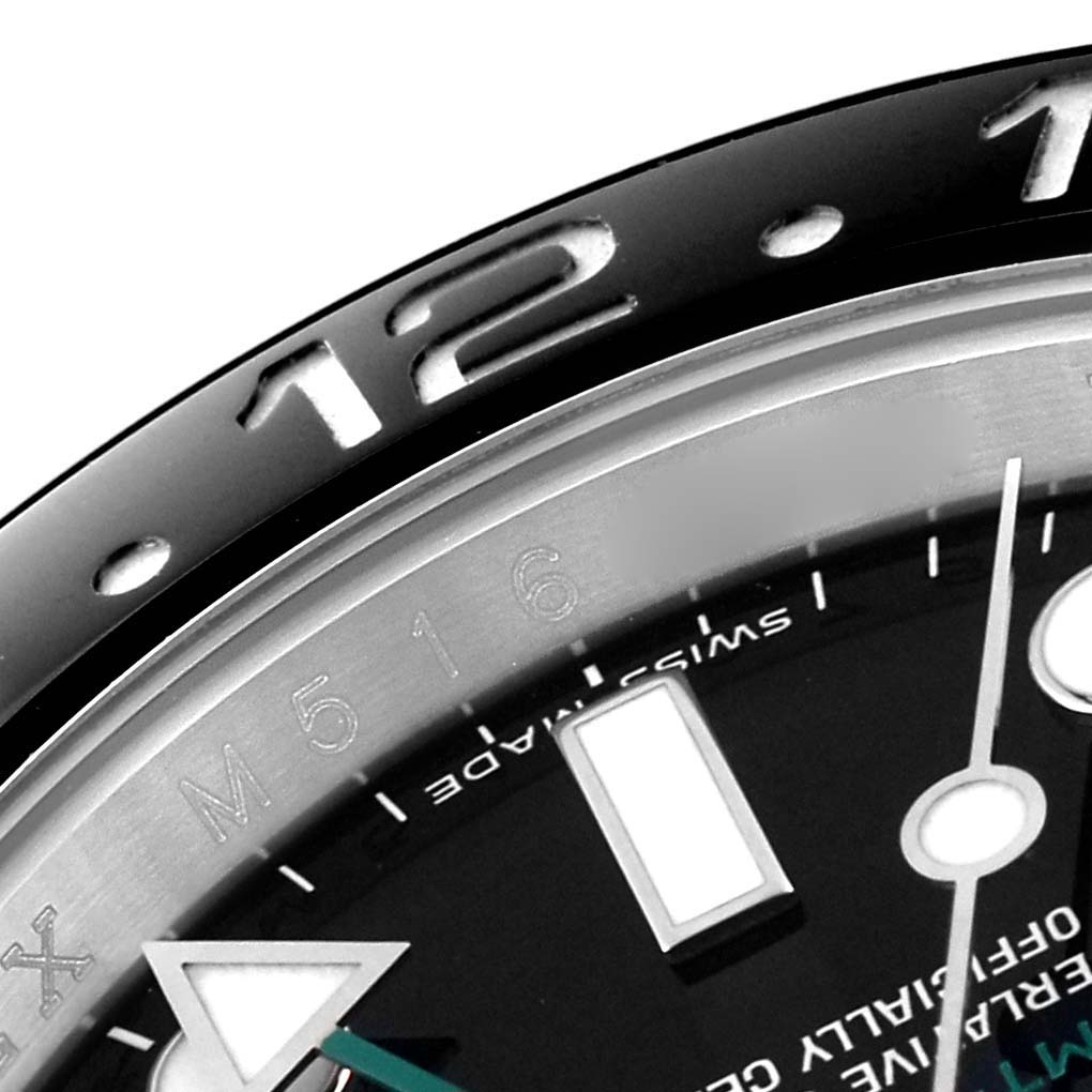 The image shows a close-up of the bezel and part of the dial of a Rolex GMT-Master 116710 Men
s Stainless Steel Black Dial 116710 Men
s Stainless Steel Black Dial watch, highlighting the numerals and markers.