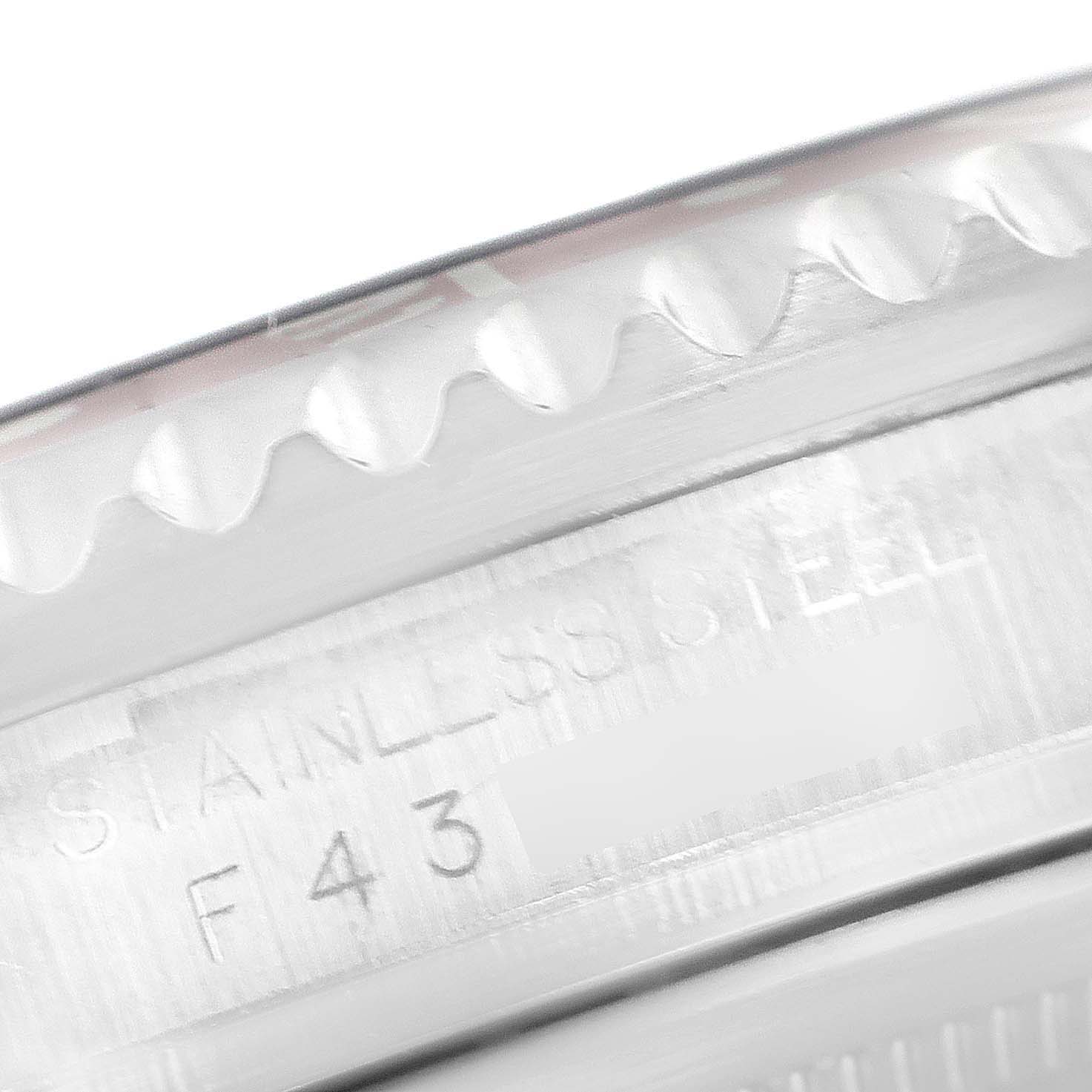 This close-up image shows the edge and engraved stainless steel case of a Rolex GMT-Master 16710 Men's Stainless Steel Black Dial 16710 Men's Stainless Steel Black Dial watch.