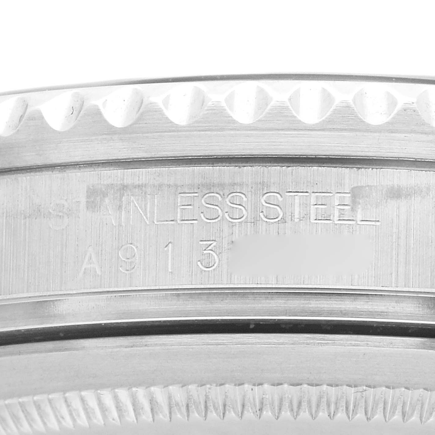 This close-up shows the stainless steel side of a Rolex GMT-Master 16710 Men's Stainless Steel Black Dial 16710 Men's Stainless Steel Black Dial bezel with model and serial numbers.