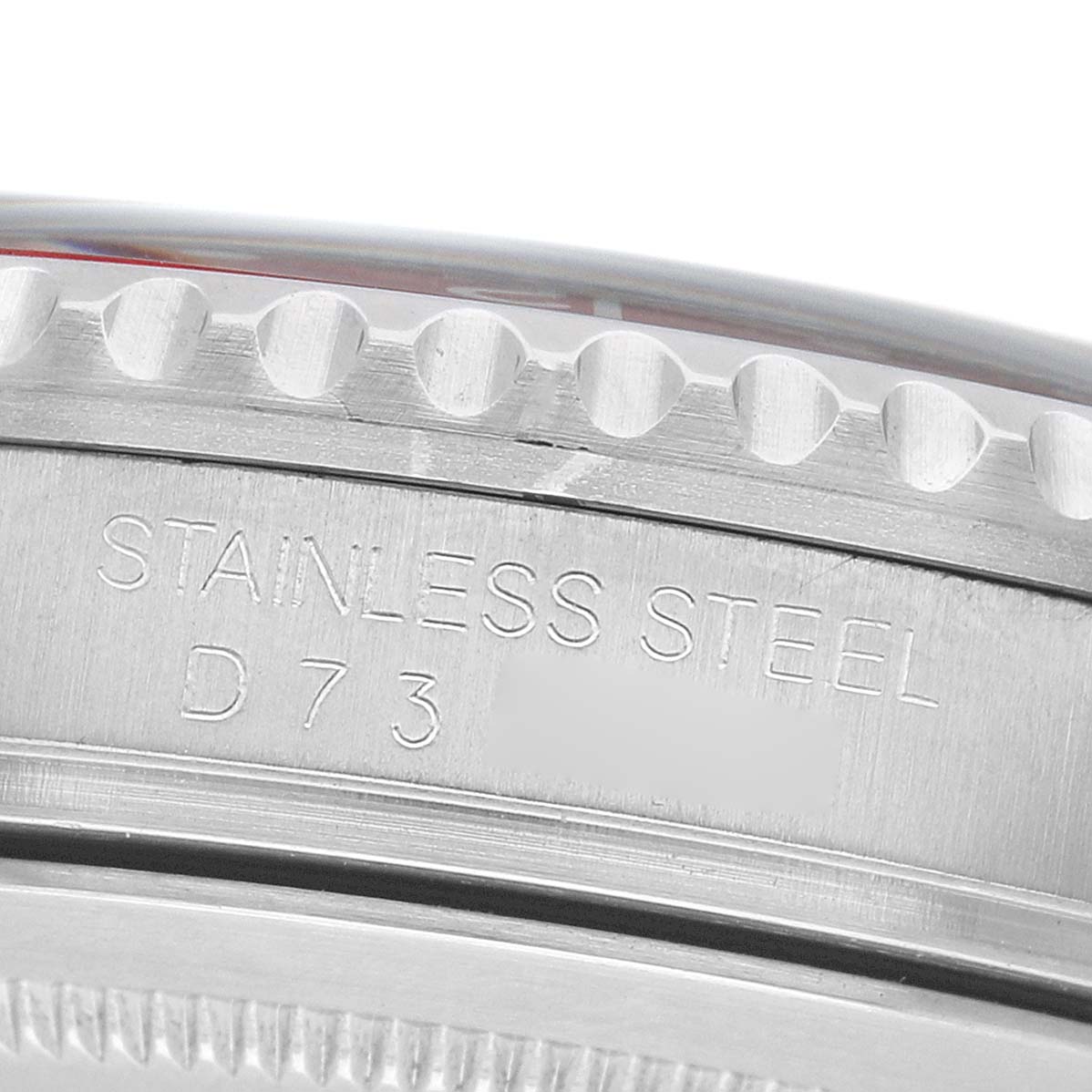 The image shows a close-up of the side of a Rolex GMT-Master 16710 Men's Stainless Steel Black Dial, highlighting the stainless steel and part of the bezel.