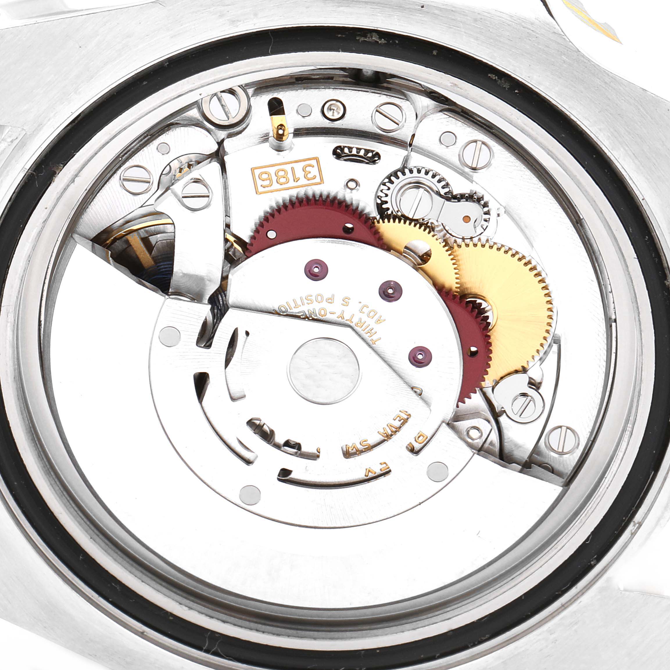 This image shows the intricate inner workings of the Rolex GMT-Master 116713 Men
s Steel and Gold (two tone) Black Dial 116713 Men
s Steel and Gold (two tone) Black Dial watch movement from a top-down angle.