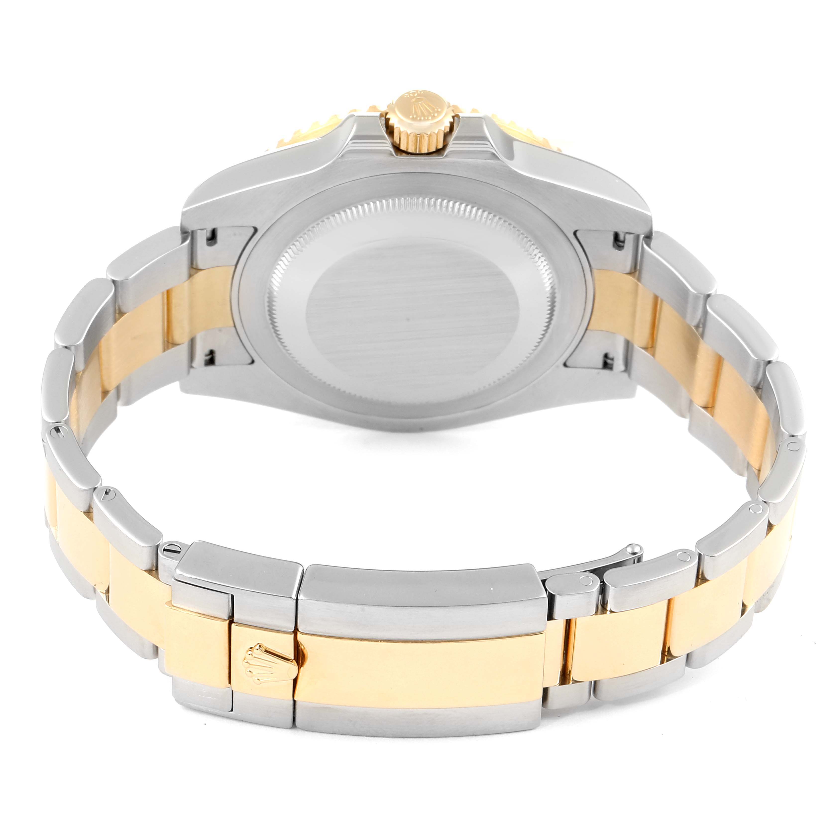 This image shows the back view of a Rolex GMT-Master 116713 Men
s Steel and Gold (two tone) Black Dial 116713 Men
s Steel and Gold (two tone) Black Dial watch, highlighting its two-tone bracelet and case back.