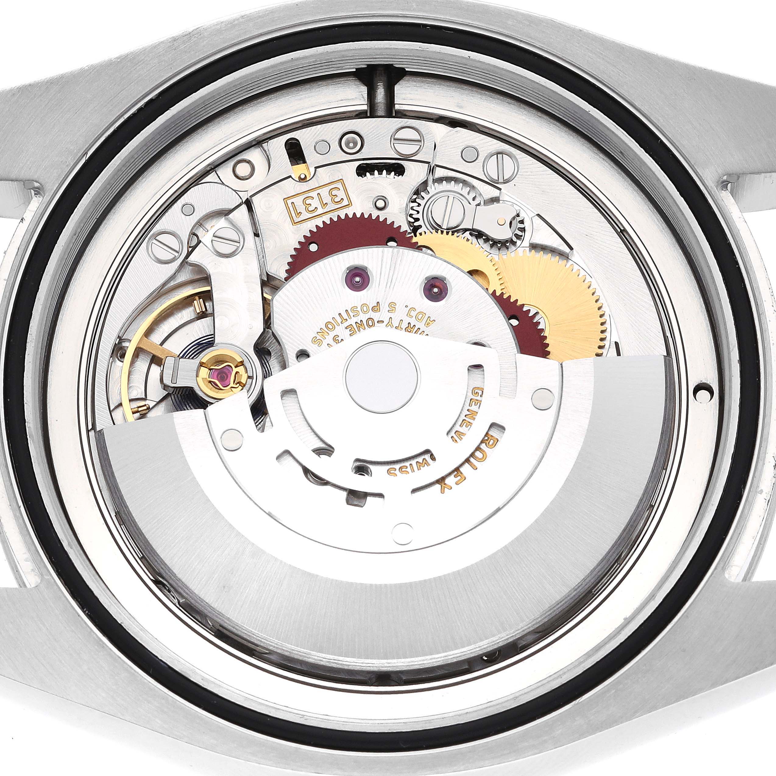 This image shows a close-up of the movement mechanism inside a Rolex Air-King 116900 Men's Stainless Steel Black Dial 116900 Men's Stainless Steel Black Dial watch, viewed from the back.