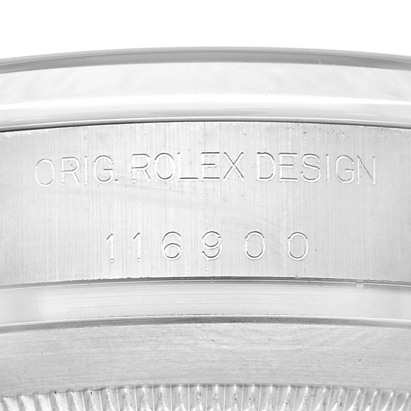 Close-up of the Air-King Rolex watch showing the serial number and "ORIG. ROLEX DESIGN" engraving.