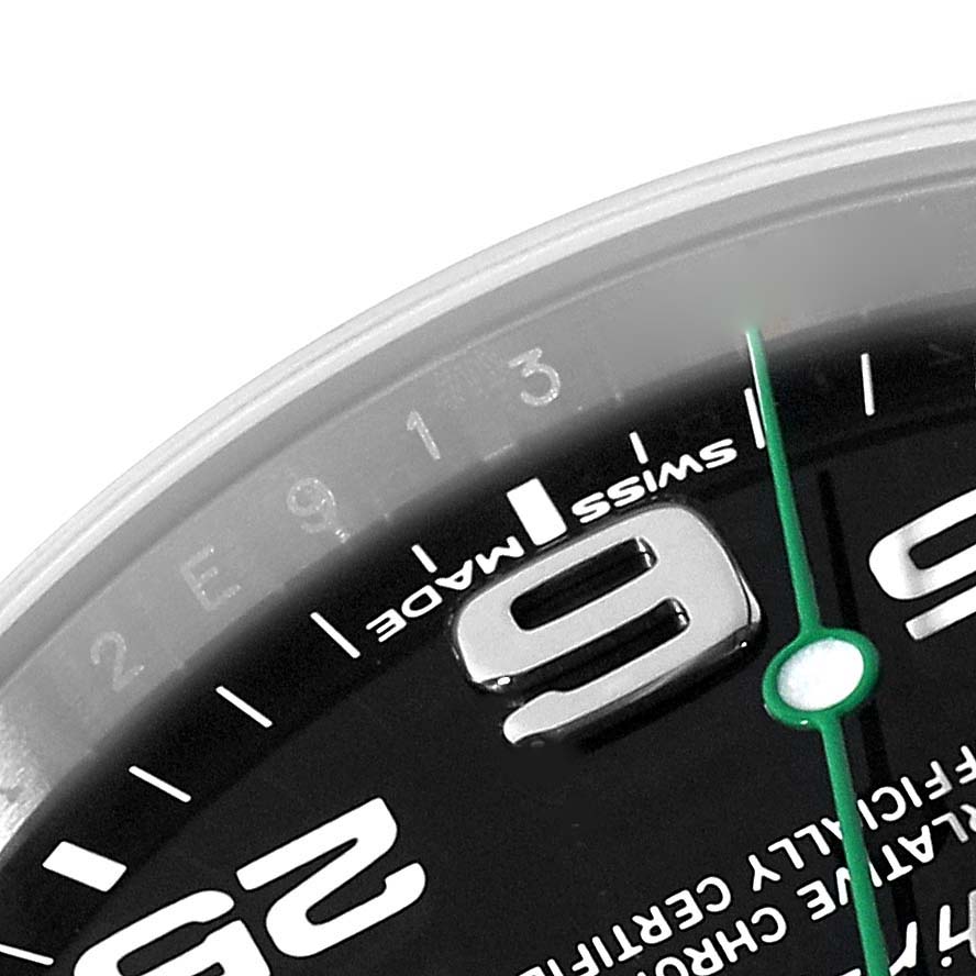 A close-up image shows a partial view of the Rolex Air-King 116900 Men's Stainless Steel Black Dial 116900 Men's Stainless Steel Black Dial watch face, focusing on the number 9, part of the second hand, and "Swiss Made" text.
