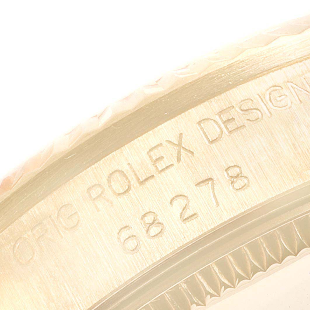This is a close-up image of the case with engraved markings on a Rolex President 68278 Women's Yellow Gold Champagne Dial 68278 Women's Yellow Gold Champagne Dial model watch.