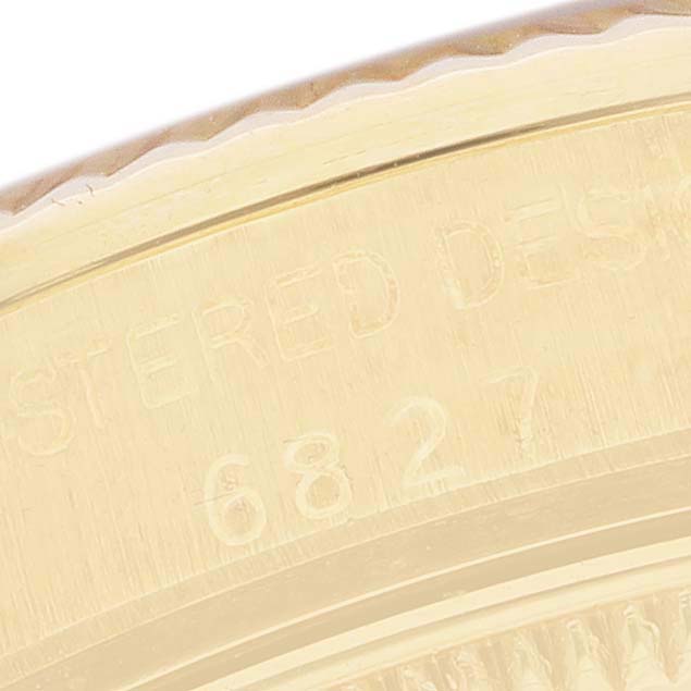 The image shows a close-up of the edge of a Rolex President 6827 Women's Yellow Gold Silver Dial model, highlighting the engraved model or serial number.
