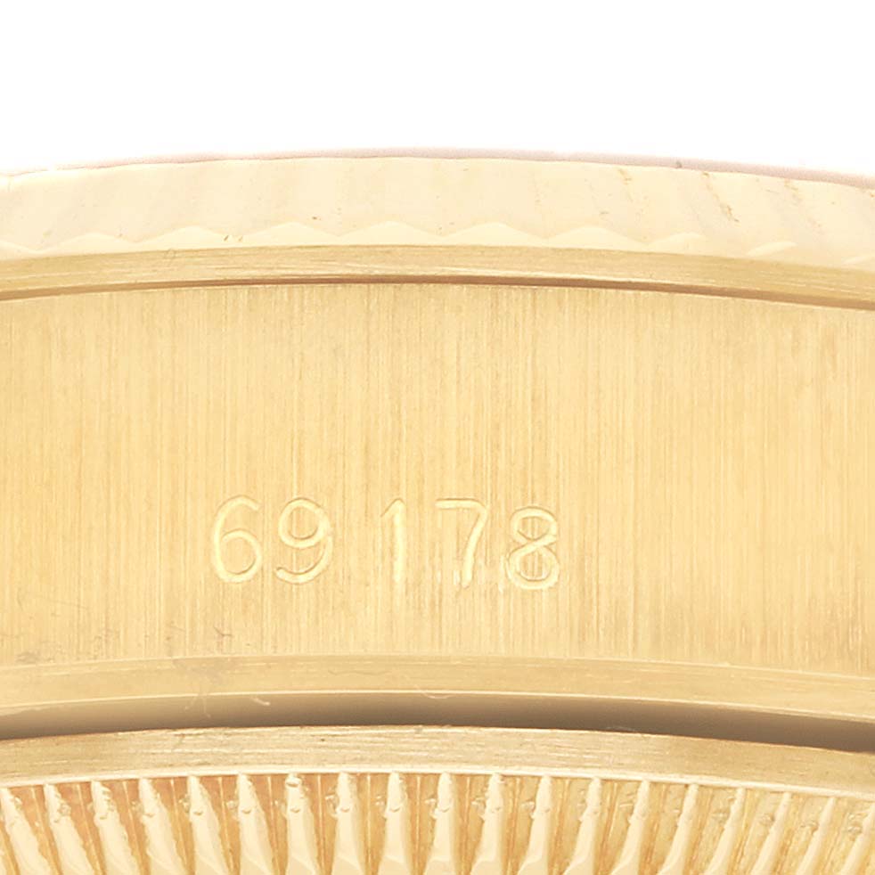 The image shows a close-up of the side of a Rolex President 69178 Women's Yellow Gold Champagne Dial 69178 Women's Yellow Gold Champagne Dial watch, highlighting the model number engraved on the case.