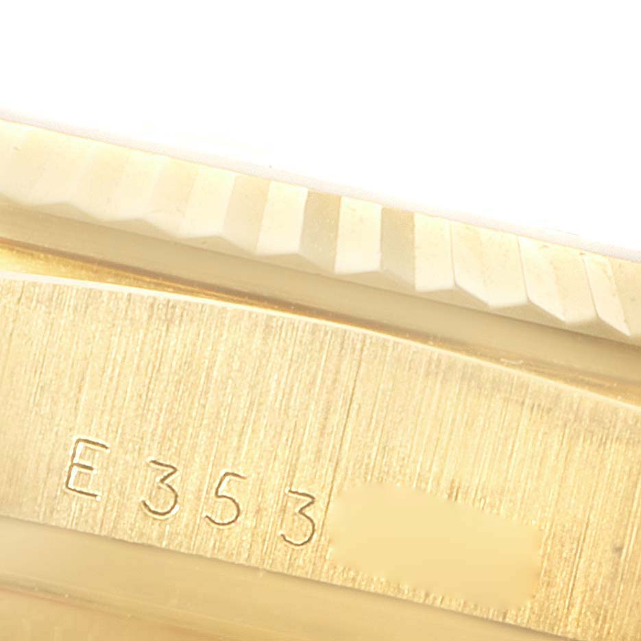 The image shows a close-up of the engraved serial number on the case of a Rolex President 18238 Men
s Yellow Gold Champagne Dial 18238 Men
s Yellow Gold Champagne Dial model watch.