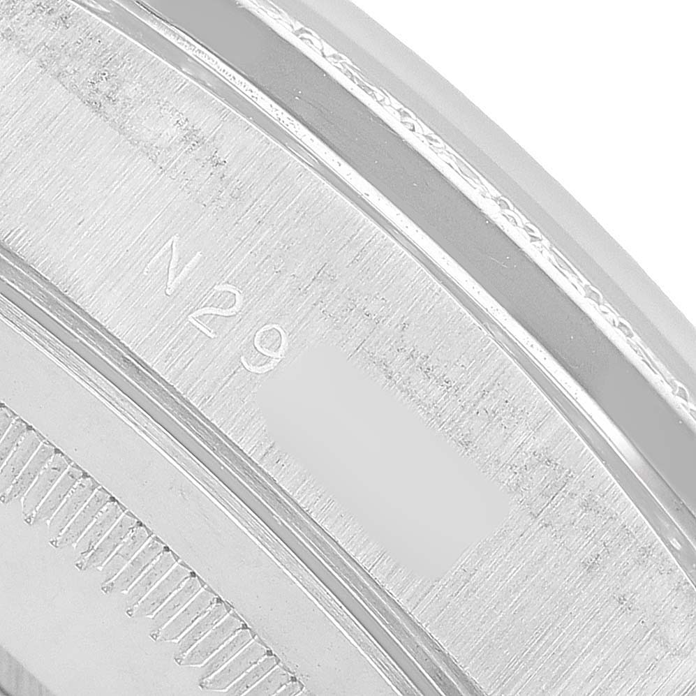 The image shows a close-up angle of the engraved back case rim of a Rolex President 18349 Men's White Gold Silver Dial model watch.