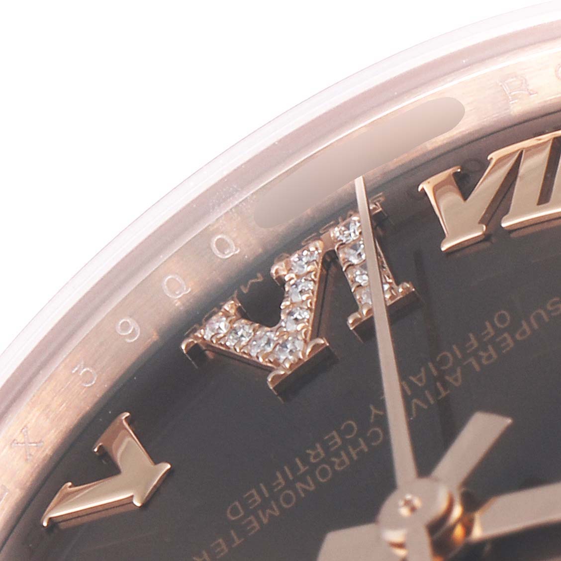 This image shows a close-up of the dial and Roman numerals on a Rolex President 278275 Women's Rose Gold Brown Dial 278275 Women's Rose Gold Brown Dial model watch.