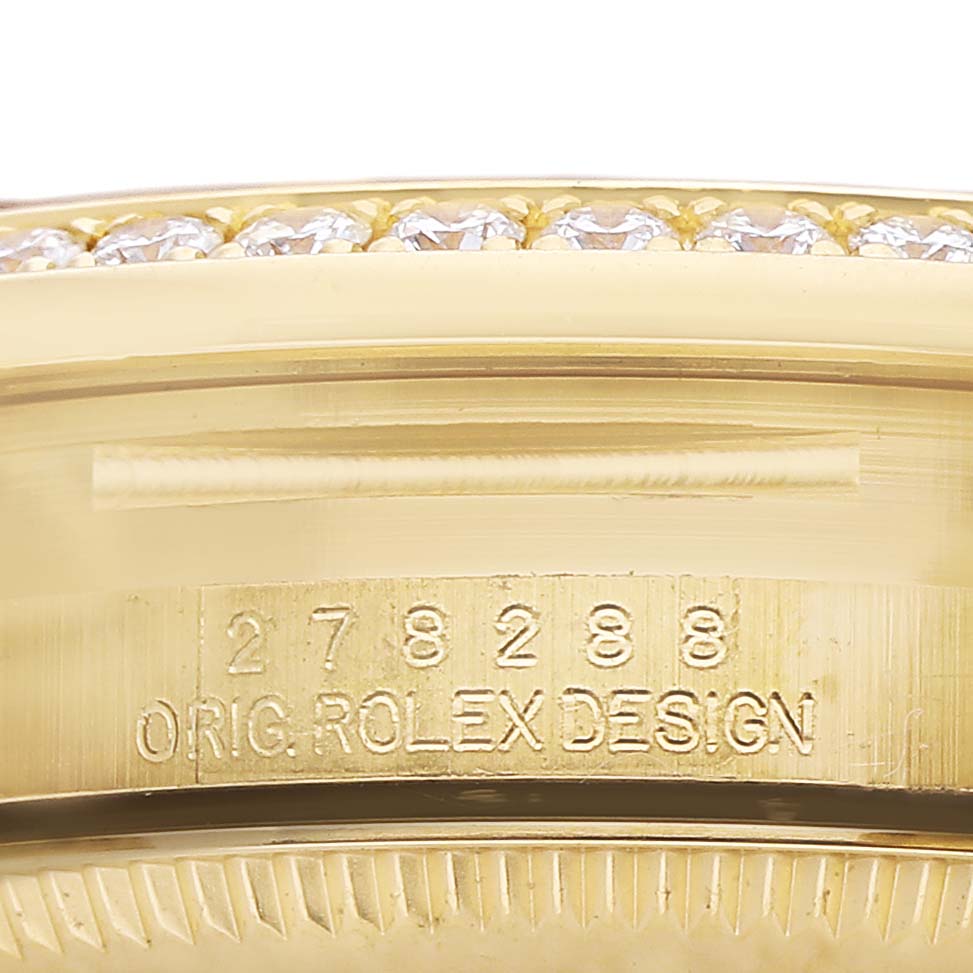 The image shows a close-up of a Rolex President 278288 Women's Yellow Gold Mother of Pearl Dial model's bezel engraving with visible diamonds.