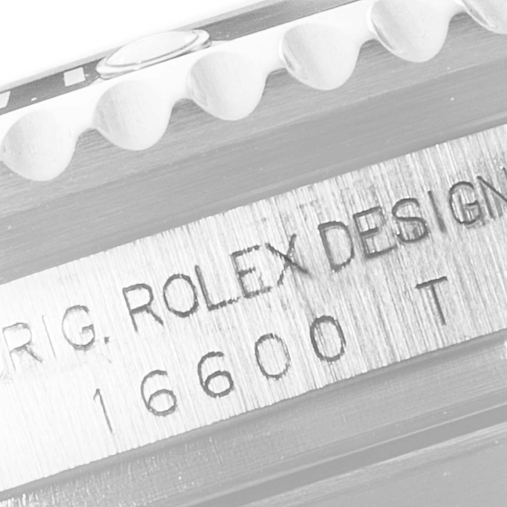 The image shows a close-up of the side of a Rolex Sea-Dweller 16600 Men
s Stainless Steel Black Dial 16600 Men
s Stainless Steel Black Dial watch model 16600, highlighting the engraved design details.