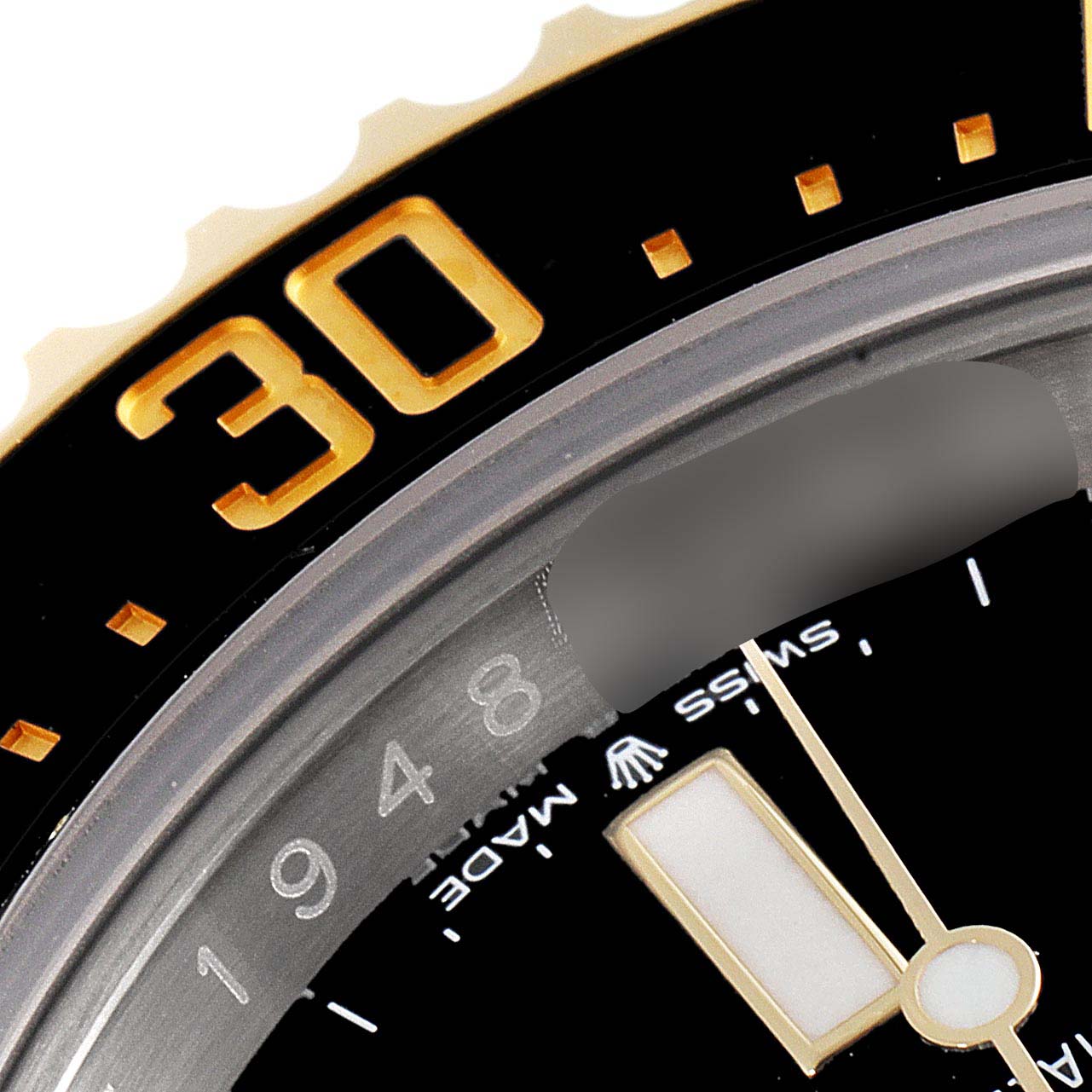 This close-up angle of the Rolex Sea-Dweller 126603 Men's Steel and Gold (two tone) Black Dial 126603 Men's Steel and Gold (two tone) Black Dial watch shows the bezel with the number 30, part of the minute hand, and the "Swiss Made" text.