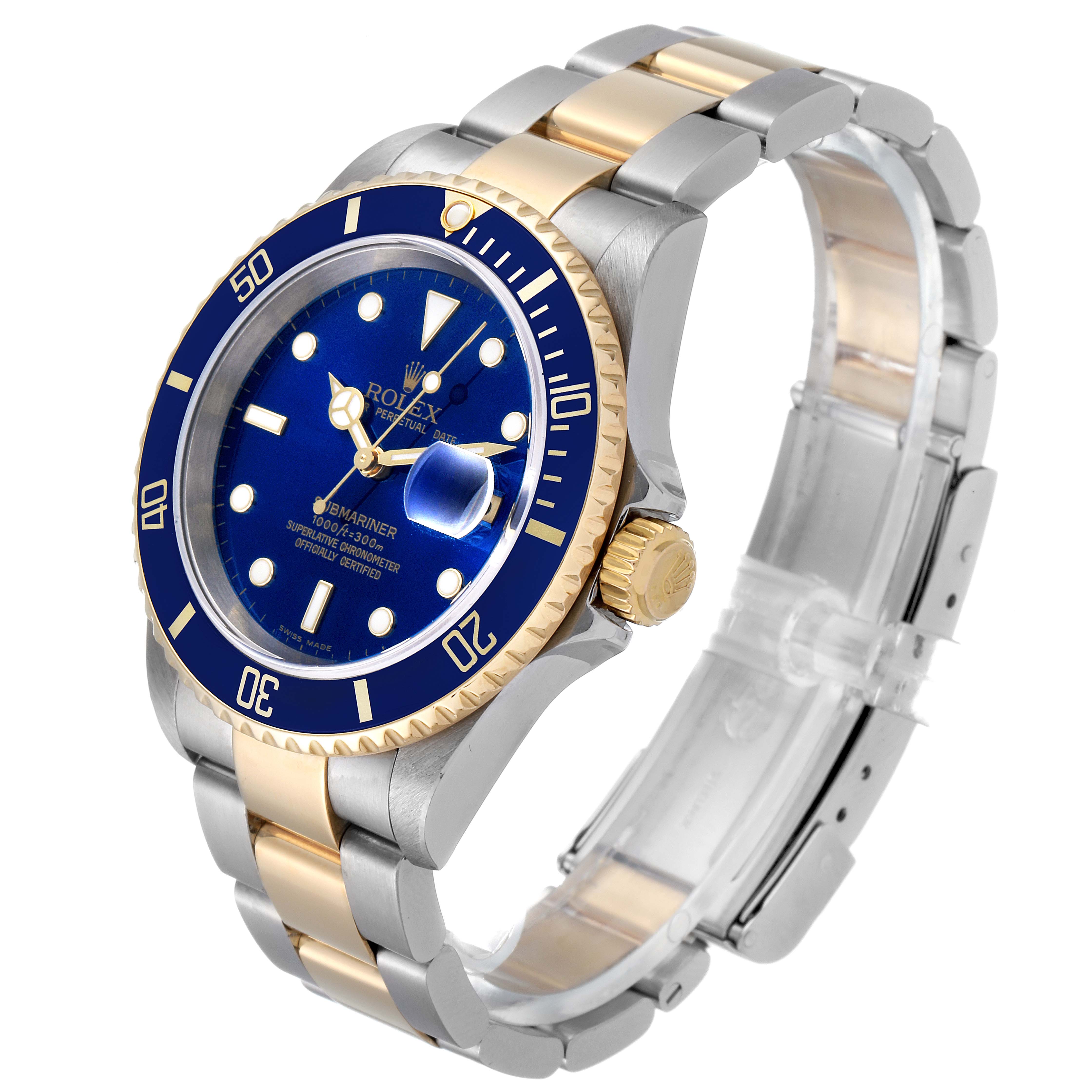 The image shows a Rolex Submariner 16613 Men's Steel and Gold (two tone) Blue Dial 16613 Men's Steel and Gold (two tone) Blue Dial watch at a three-quarter angle highlighting its blue dial, two-tone bracelet, and bezel.