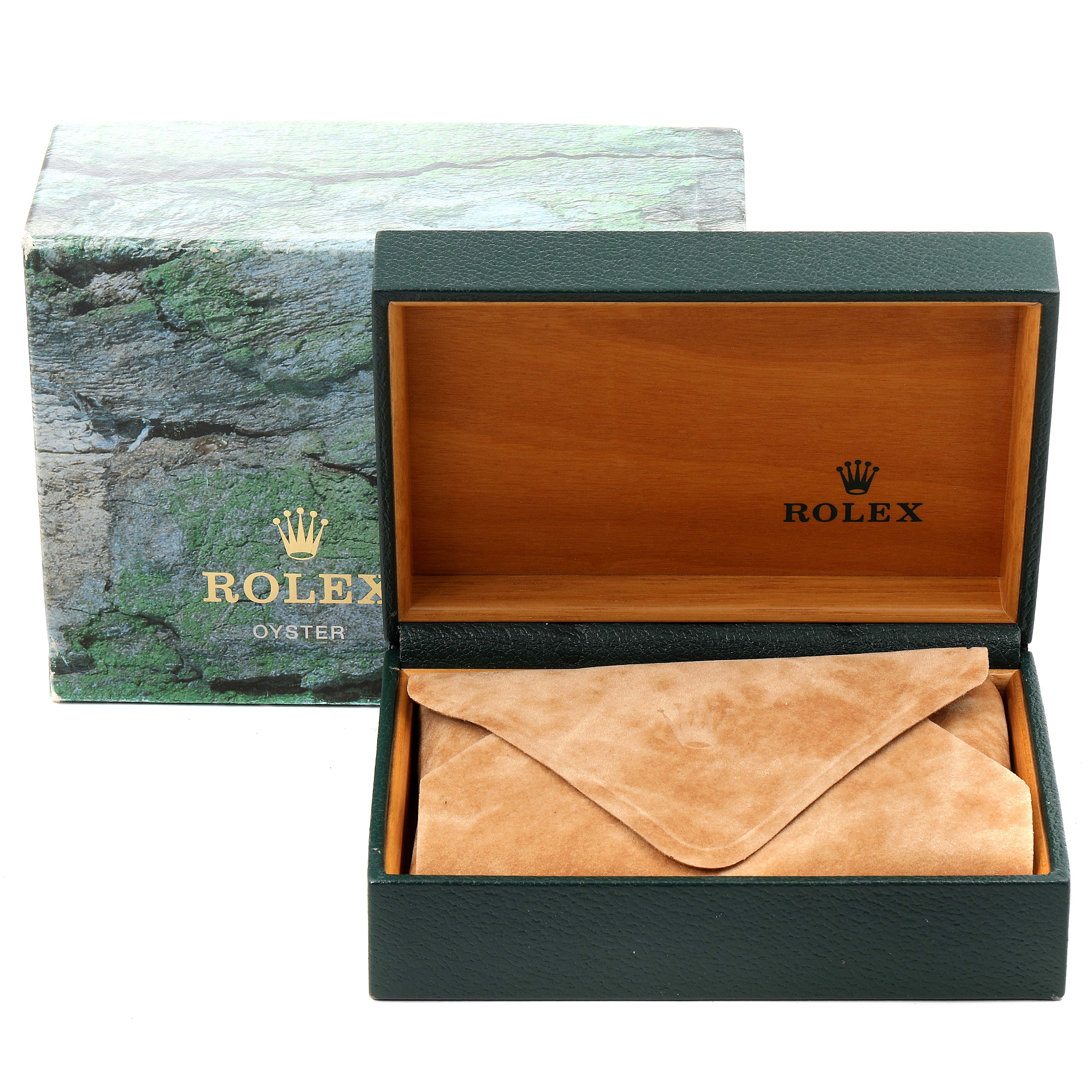 The image shows a Rolex Submariner 16613 Men's Steel and Gold (two tone) Blue Dial 16613 Men's Steel and Gold (two tone) Blue Dial watch box with an open wood-finished interior and a suede pouch inside.