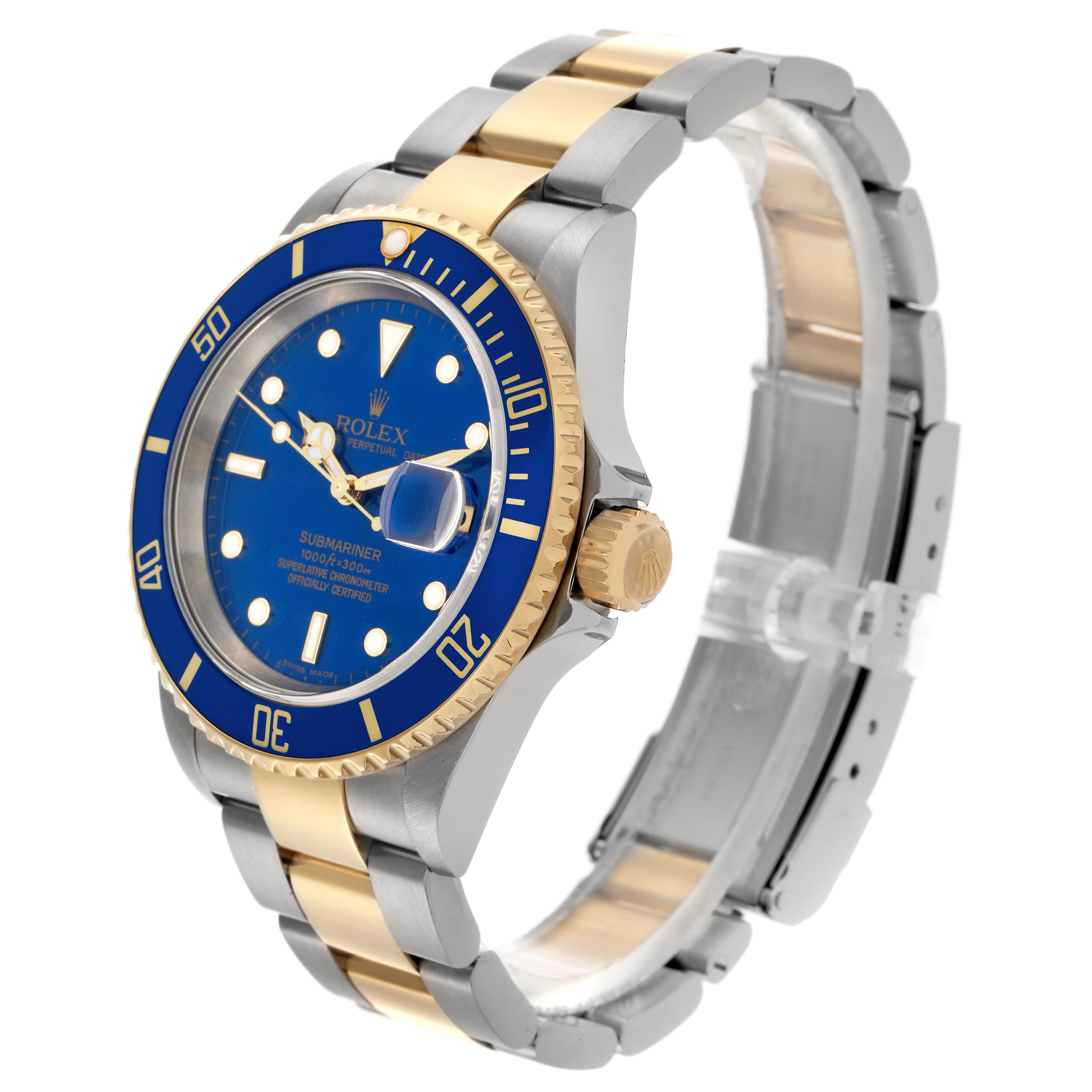The Rolex Submariner 16613 Men's Steel and Gold (two tone) Blue Dial 16613 Men's Steel and Gold (two tone) Blue Dial watch is shown at a three-quarter angle, displaying its blue dial, bezel, and two-tone bracelet.