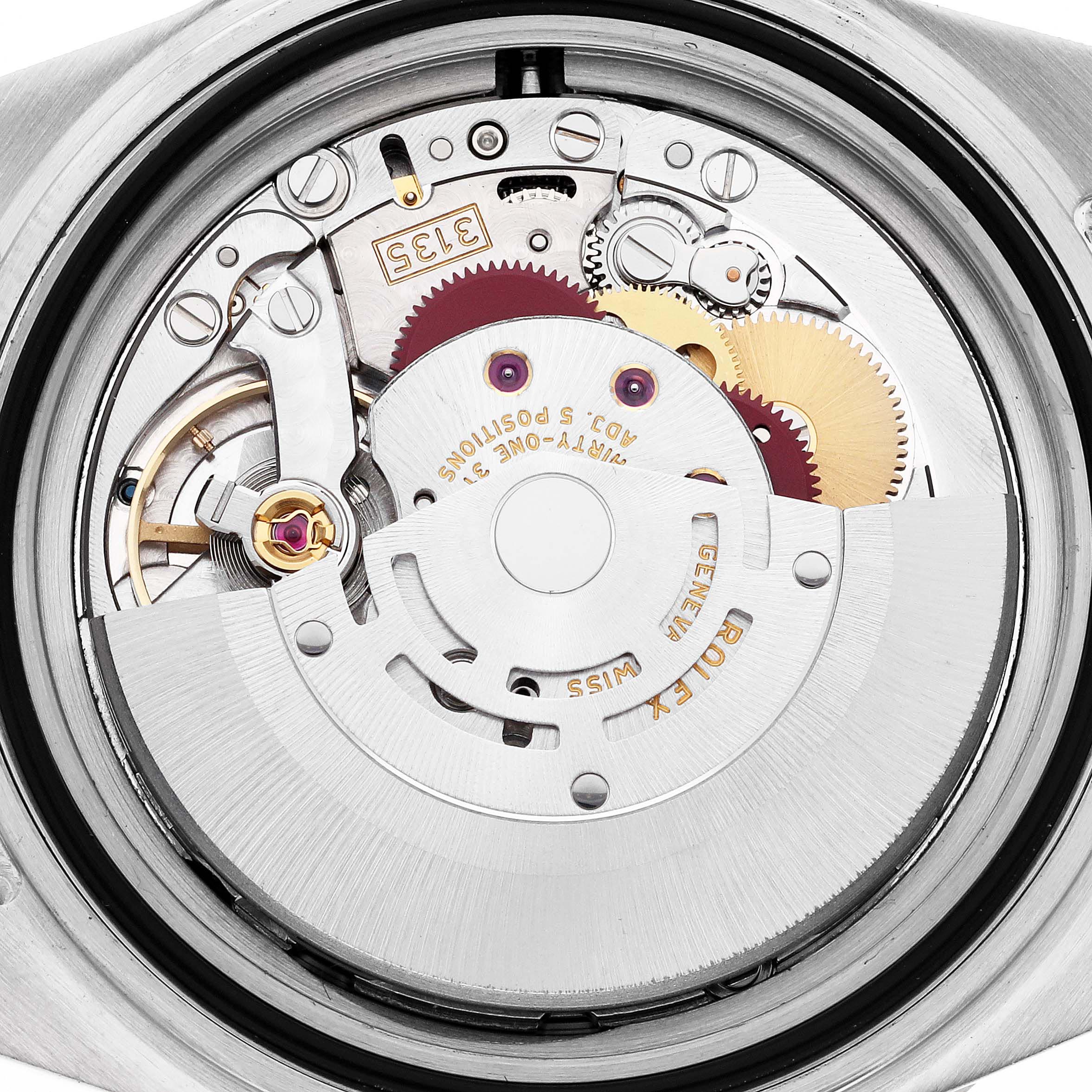 The image shows the internal movement of a Rolex Submariner 16613 Men's Steel and Gold (two tone) Blue Dial 16613 Men's Steel and Gold (two tone) Blue Dial, highlighting gears and the rotor from a top-down angle.