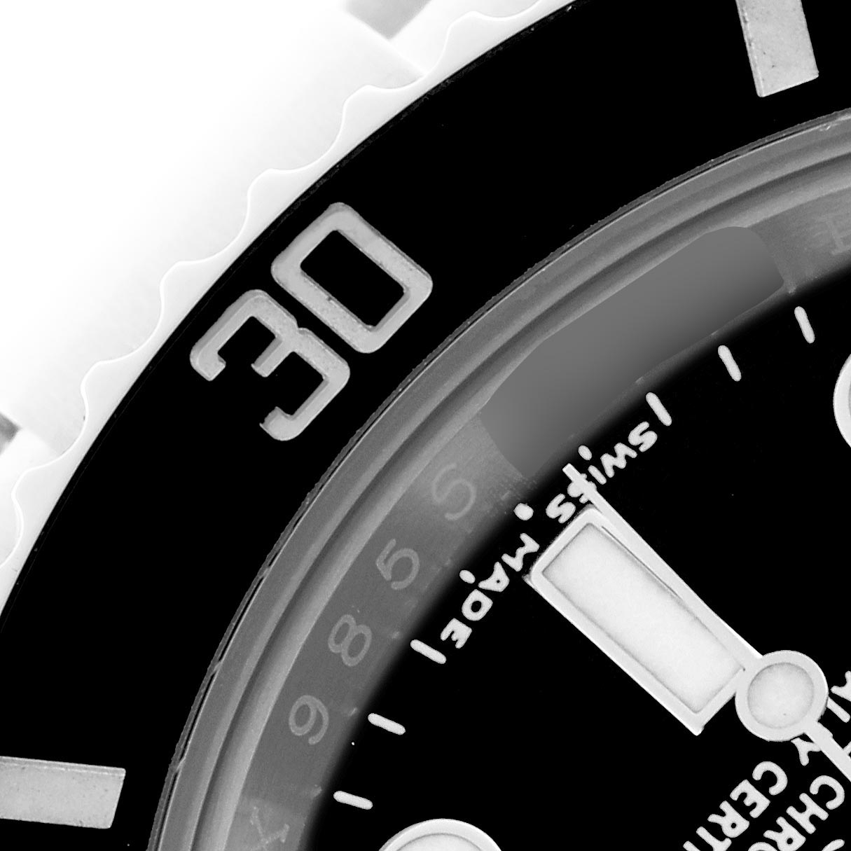 The image shows a close-up of the bezel and part of the dial of a Rolex Submariner 116610LN Men's Stainless Steel Black Dial 116610LN Men's Stainless Steel Black Dial watch, highlighting the 30-minute mark.