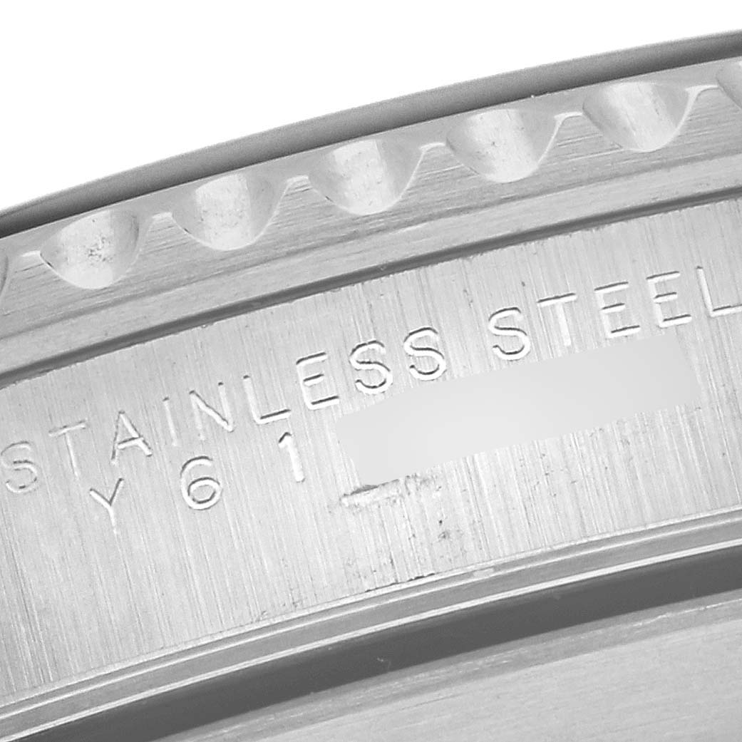 This image shows an extreme close-up of the engraving on the stainless steel back of a Rolex Submariner 14060 Men
s Stainless Steel Black Dial 14060 Men
s Stainless Steel Black Dial watch.