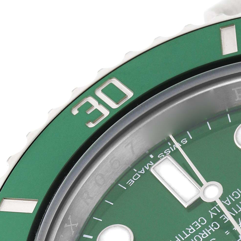 The image shows a close-up of the Rolex Submariner 116610LV Men's Stainless Steel Green Dial's green bezel and part of the watch face, highlighting the 30-minute marker.