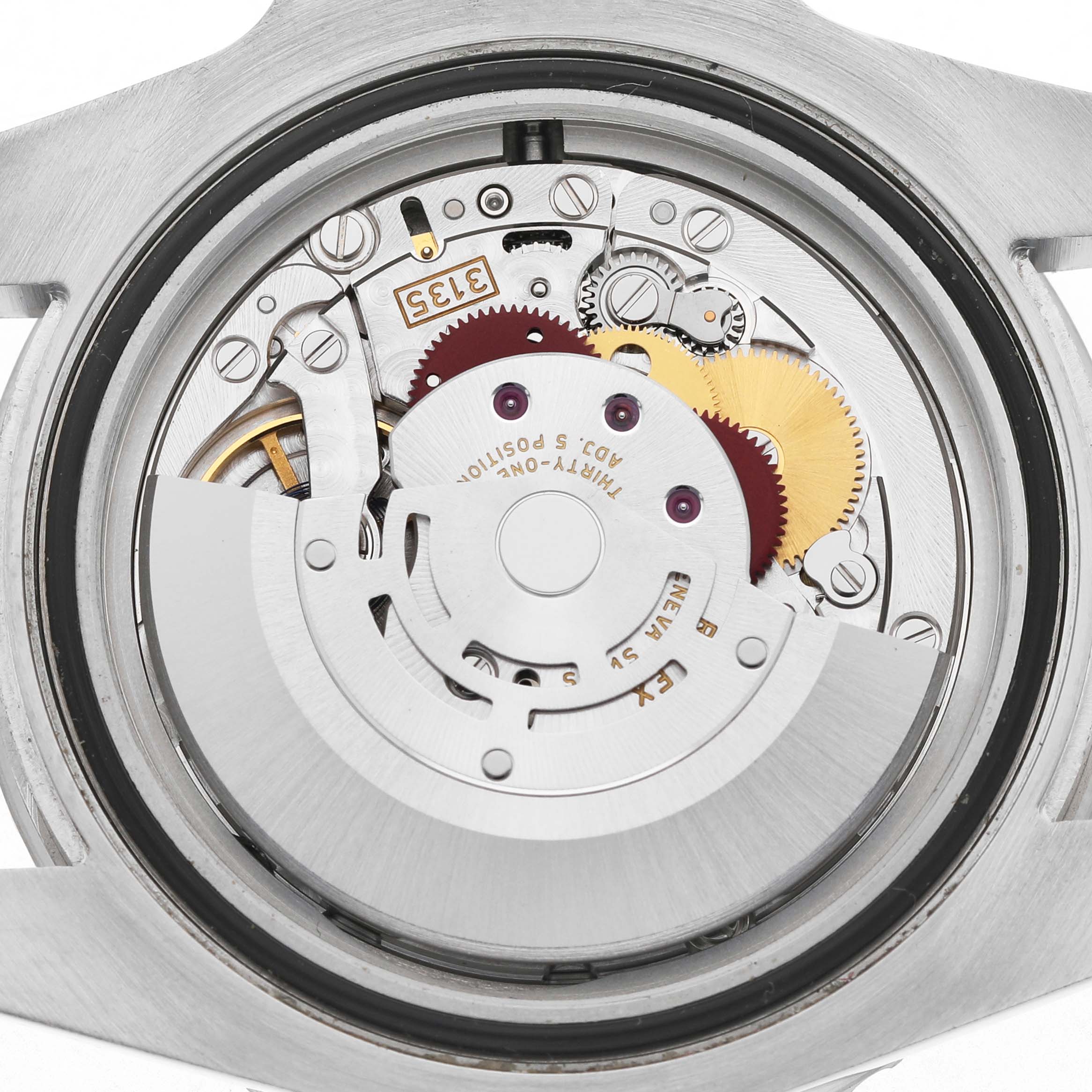 The image shows the internal mechanism of a Rolex Submariner 116610LV Men's Stainless Steel Green Dial watch, featuring gears and the rotor from the back view.