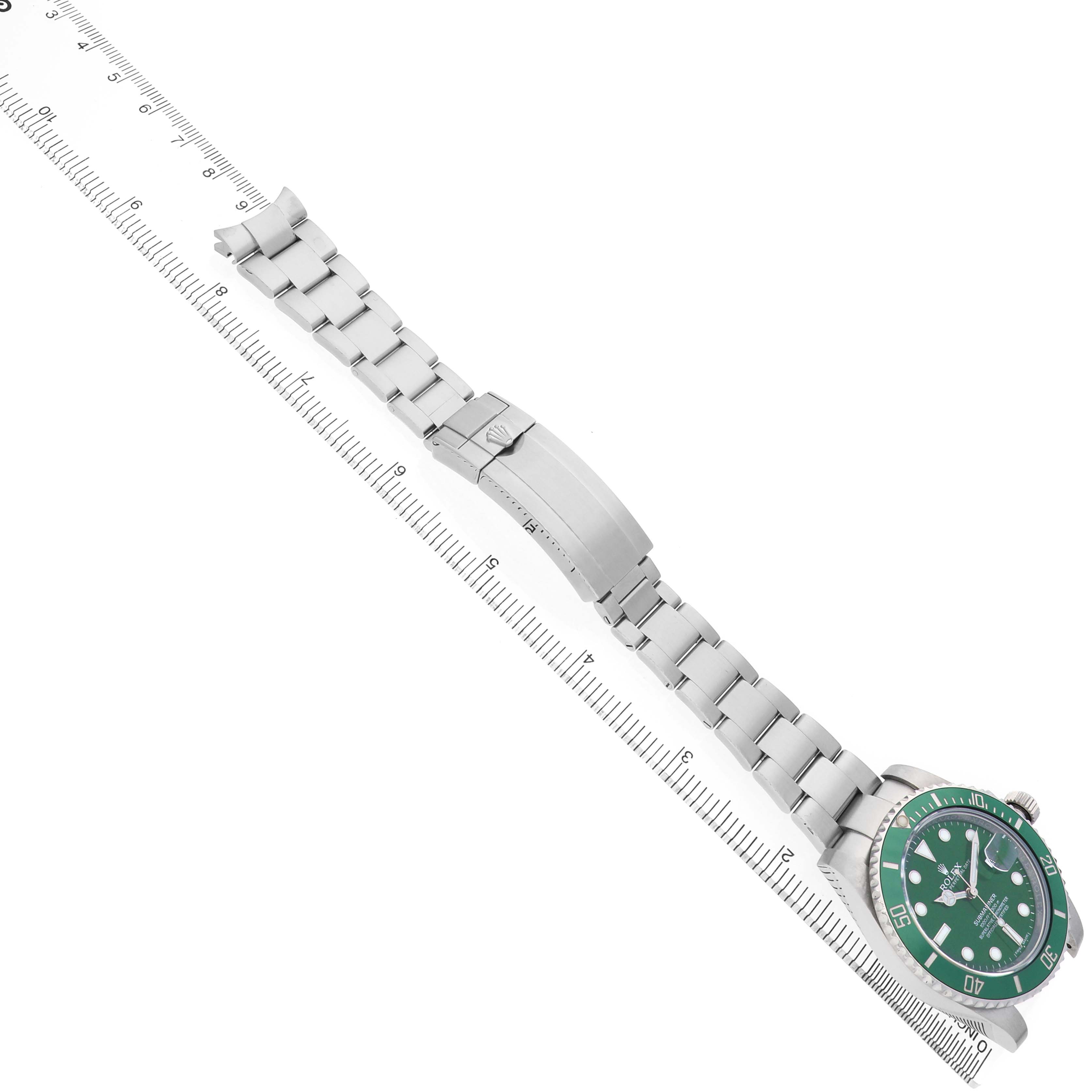 The Rolex Submariner 116610LV Men's Stainless Steel Green Dial watch is shown from a top-down angle, highlighting the bracelet and green bezel.