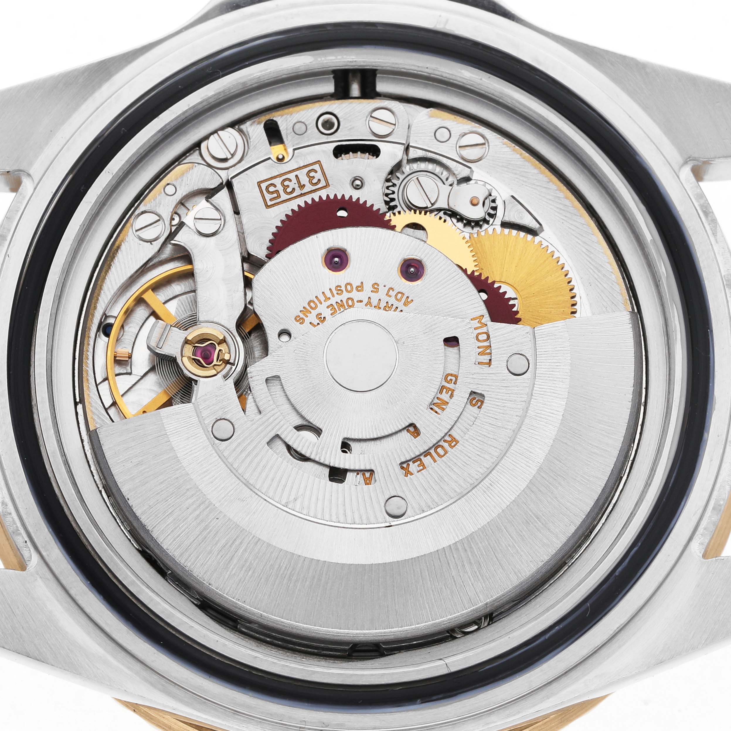 The image shows the movement of a Rolex Submariner 16613 Men's Steel and Gold (two tone) Blue Dial model, featuring gears and intricate internal components from a top-down angle.