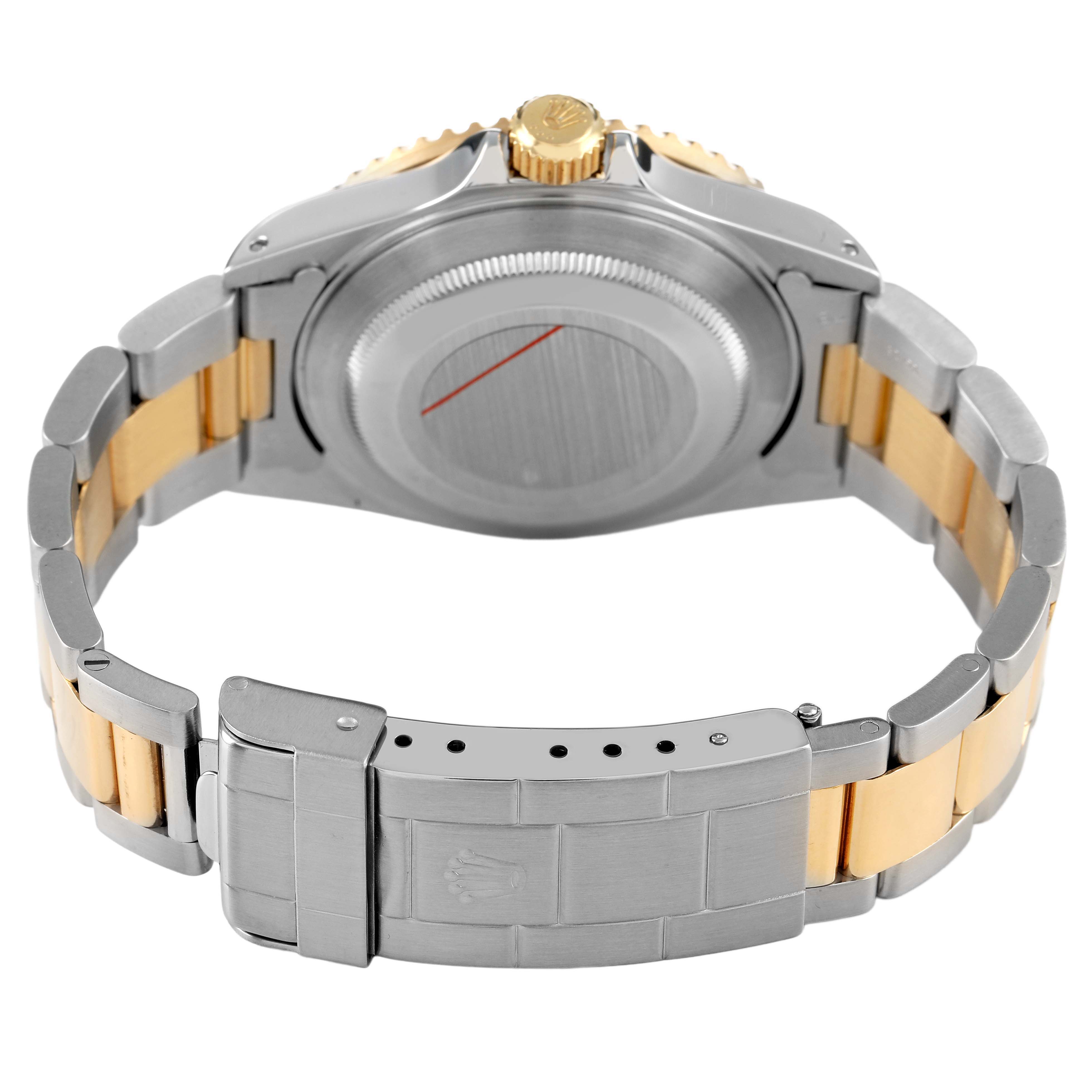 The image shows the back and clasp of a Rolex Submariner 16613 Men's Steel and Gold (two tone) Blue Dial, highlighting the case back, bracelet, and crown.