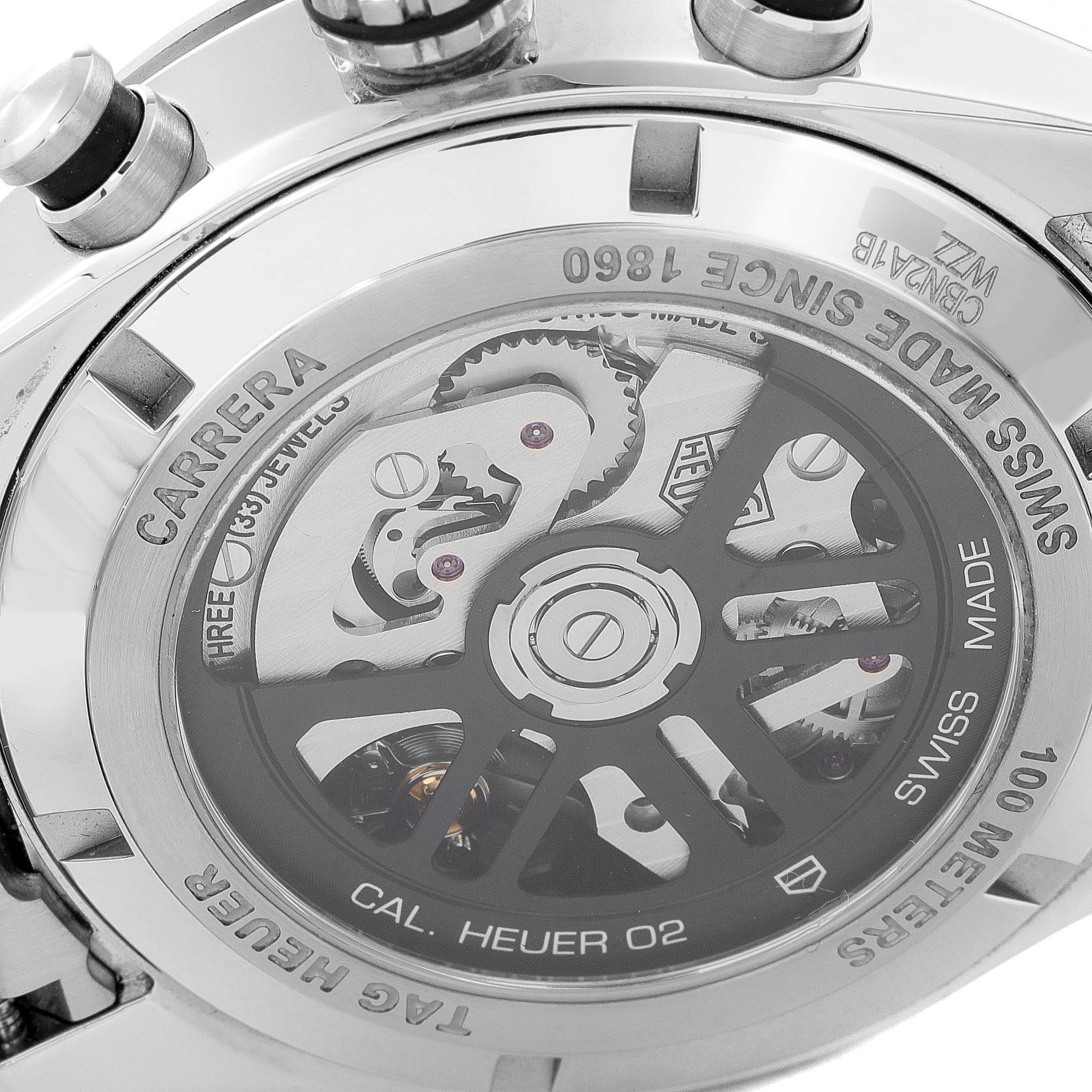 The image shows the back case of a Tag Heuer Carrera CBN2A1B.BA0643 Men's Stainless Steel Black Dial CBN2A1B.BA0643 Men's Stainless Steel Black Dial watch, featuring its automatic movement and engravings.