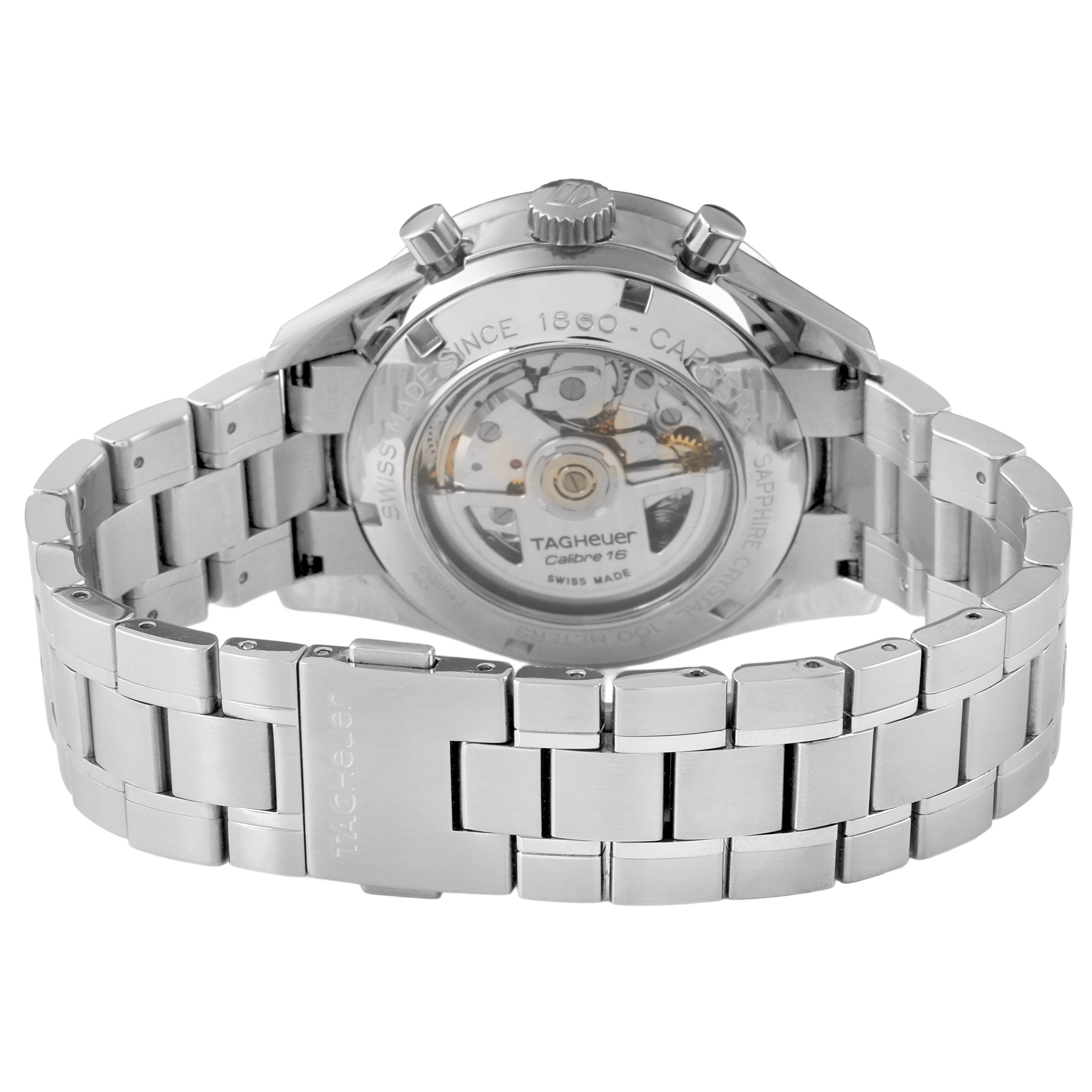 The image shows the back of a Tag Heuer Carrera CV2014 Men's Stainless Steel Black Dial watch, highlighting its transparent case back and metal bracelet.