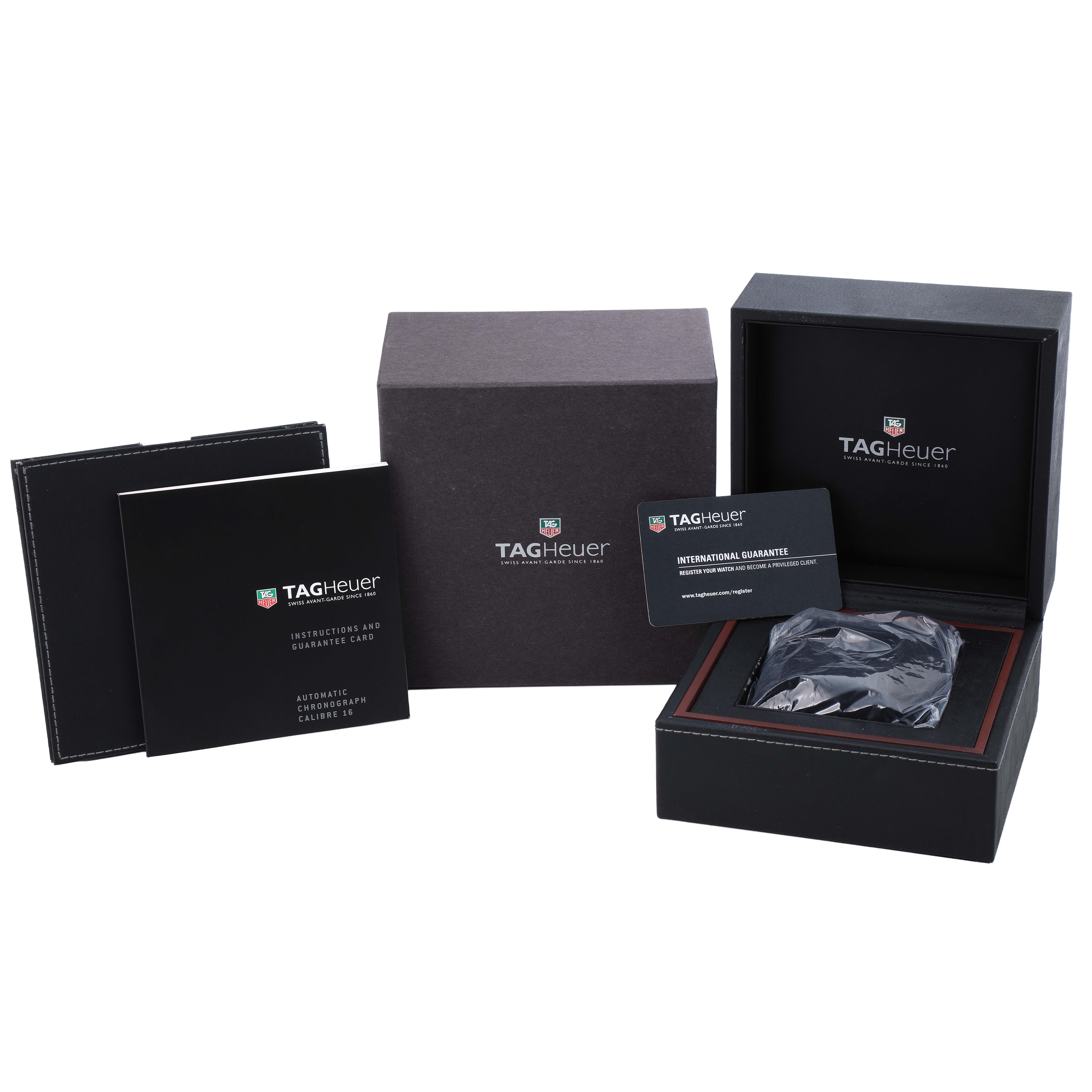 The image shows a Tag Heuer Carrera CV2014 Men's Stainless Steel Black Dial watch set, including the box, guarantee card, and instruction manual, from a front angle.