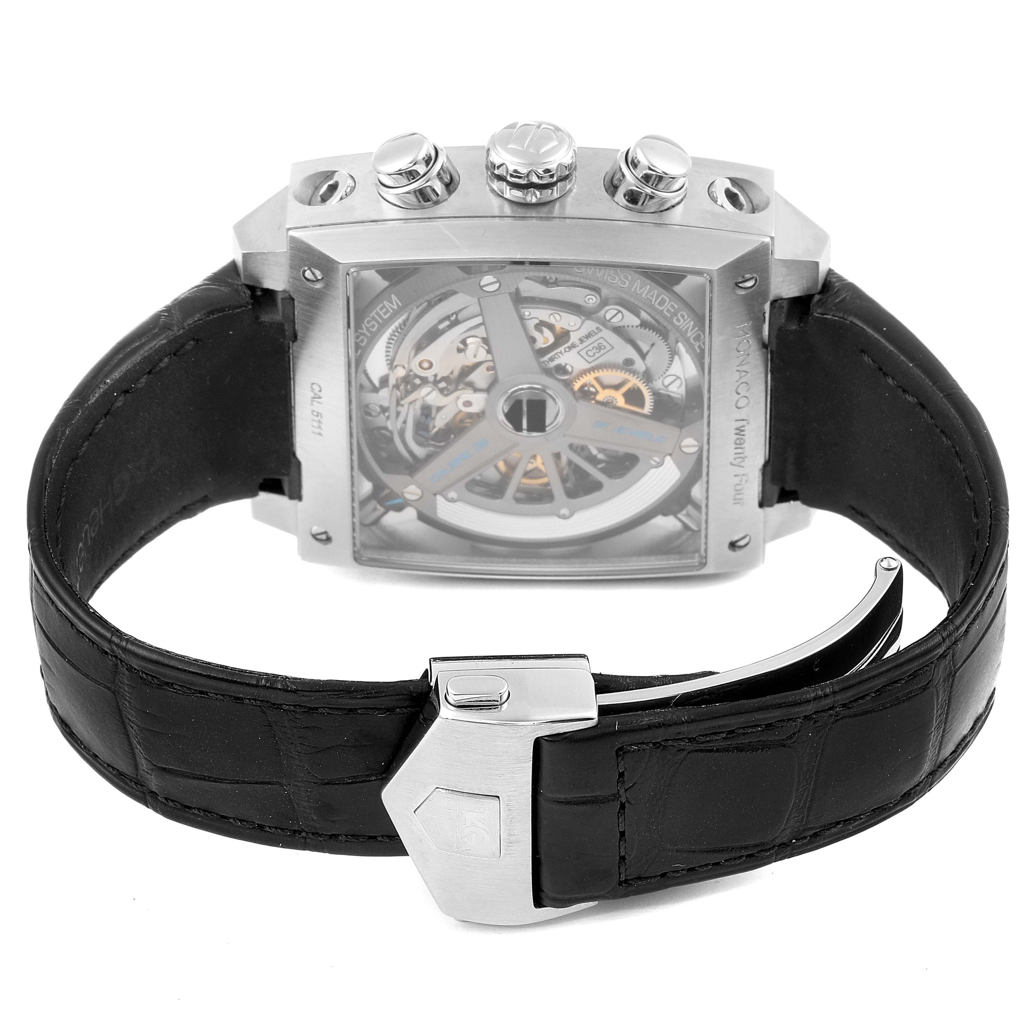 The image shows the back view of a Tag Heuer Monaco CAL5111.FC6299 Men
s Stainless Steel Blue Dial CAL5111.FC6299 Men
s Stainless Steel Blue Dial watch, highlighting its inner mechanism and black leather strap with clasp.