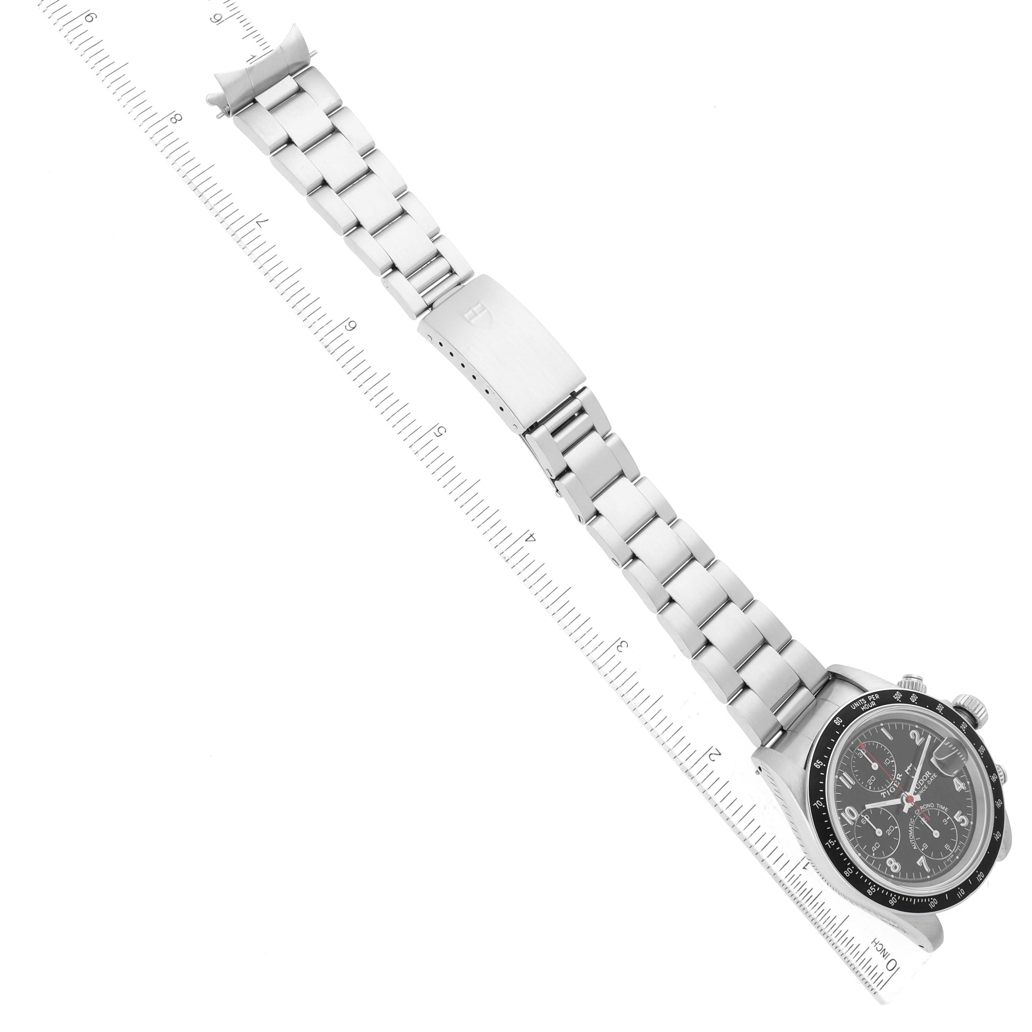 The image shows a Tudor Prince model watch, showcasing its face and metal bracelet, aligned next to a measured ruler.