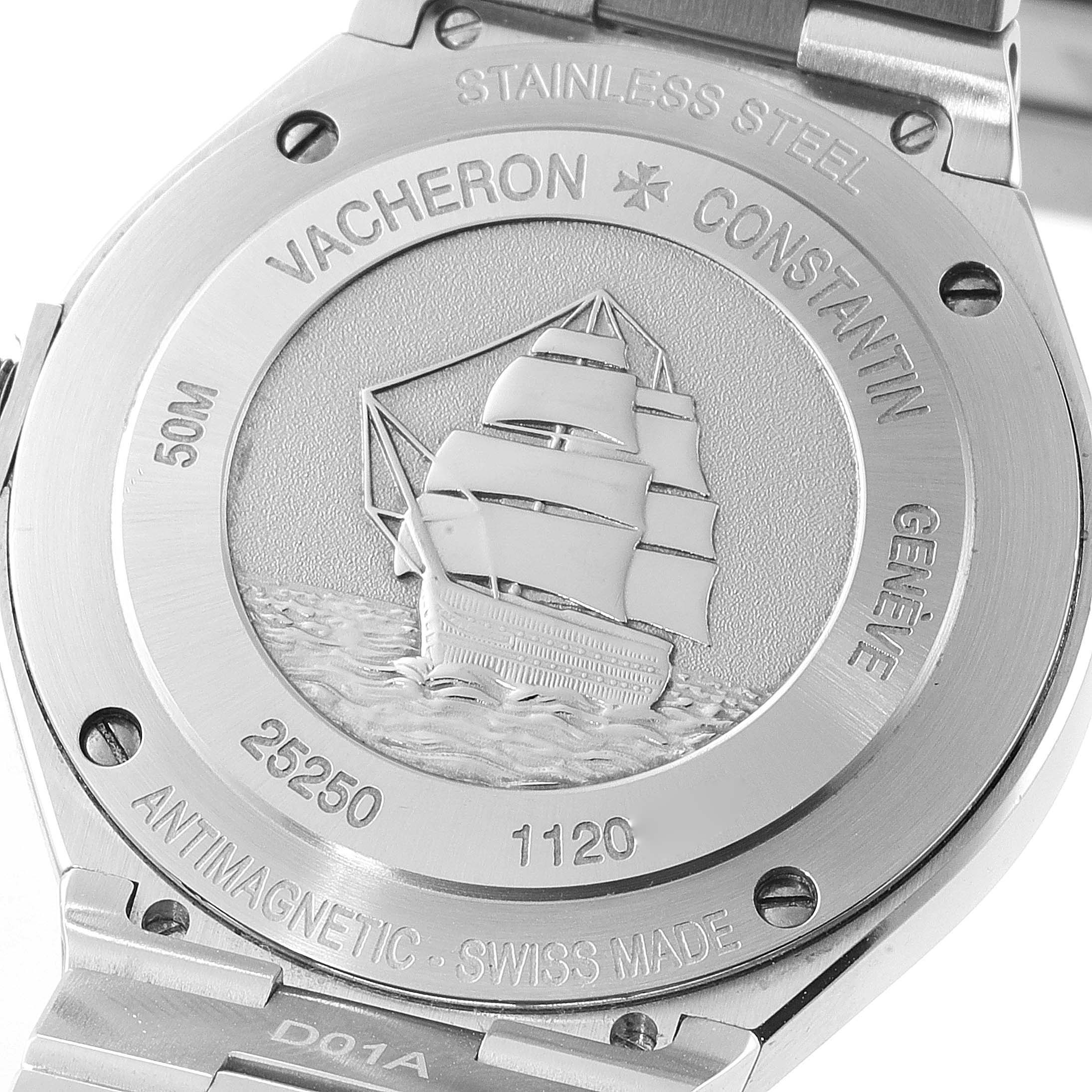 The image shows the back case of a Vacheron Constantin Overseas 25250/D01A-9092 Women's Stainless Steel Mother of Pearl Dial 25250/D01A-9092 Women's Stainless Steel Mother of Pearl Dial watch, featuring an engraved ship and various inscriptions.
