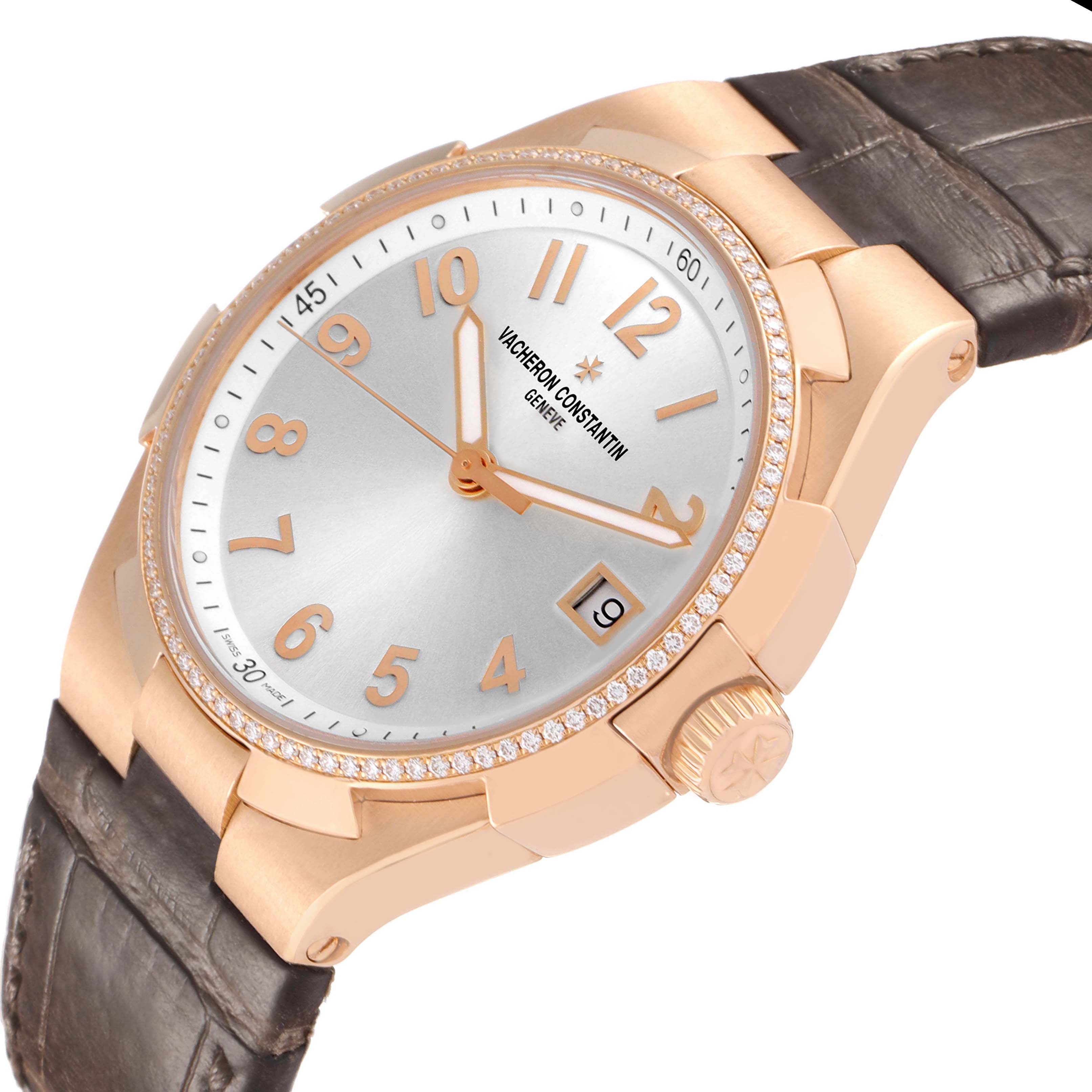 The Vacheron Constantin Overseas 47560/000R-9672 Women's Rose Gold Silver Dial watch is shown at a tilted angle, displaying its dial, bezel, crown, and part of the strap.