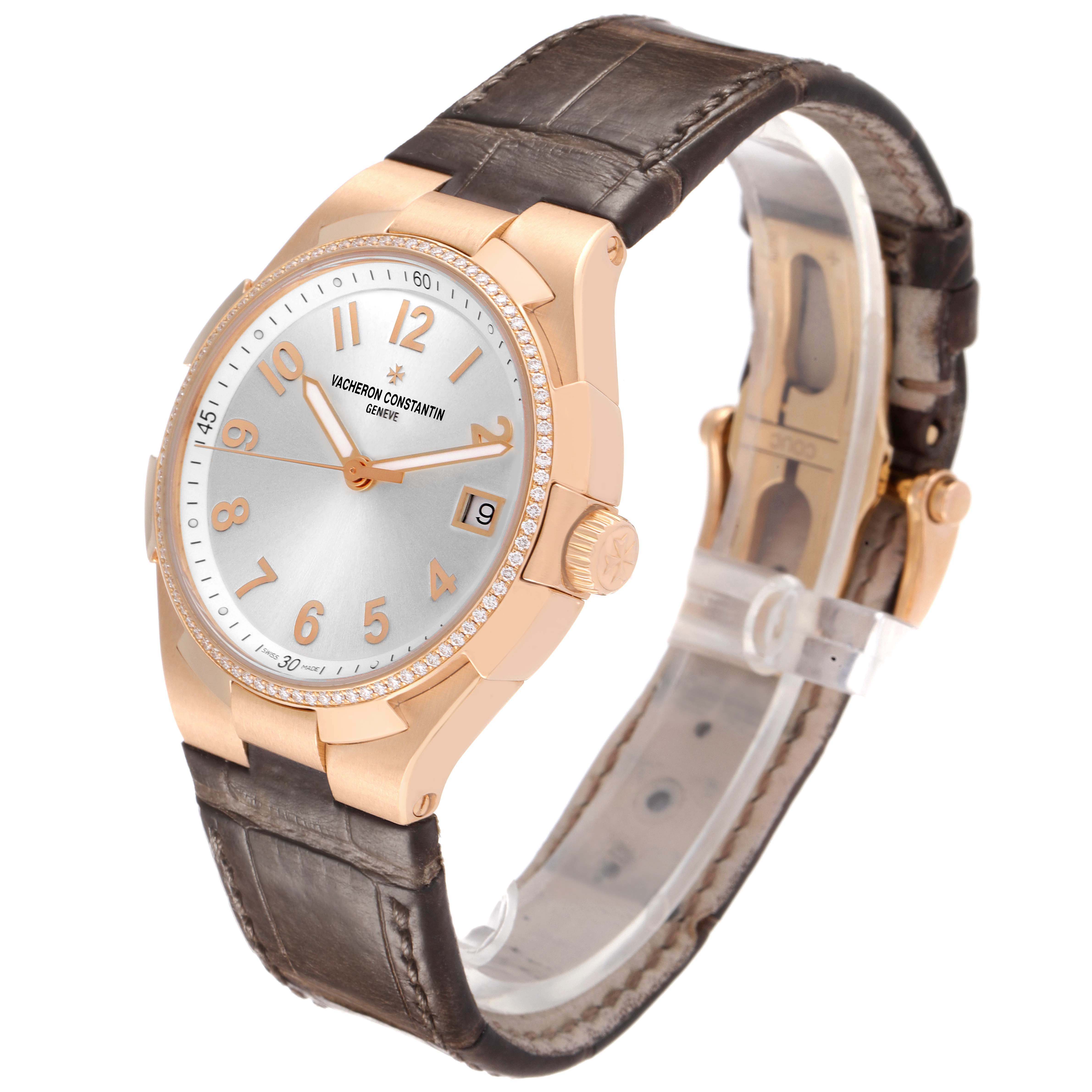 The Vacheron Constantin Overseas 47560/000R-9672 Women's Rose Gold Silver Dial watch is shown at an angled front view, highlighting its dial, bezel, and leather strap.
