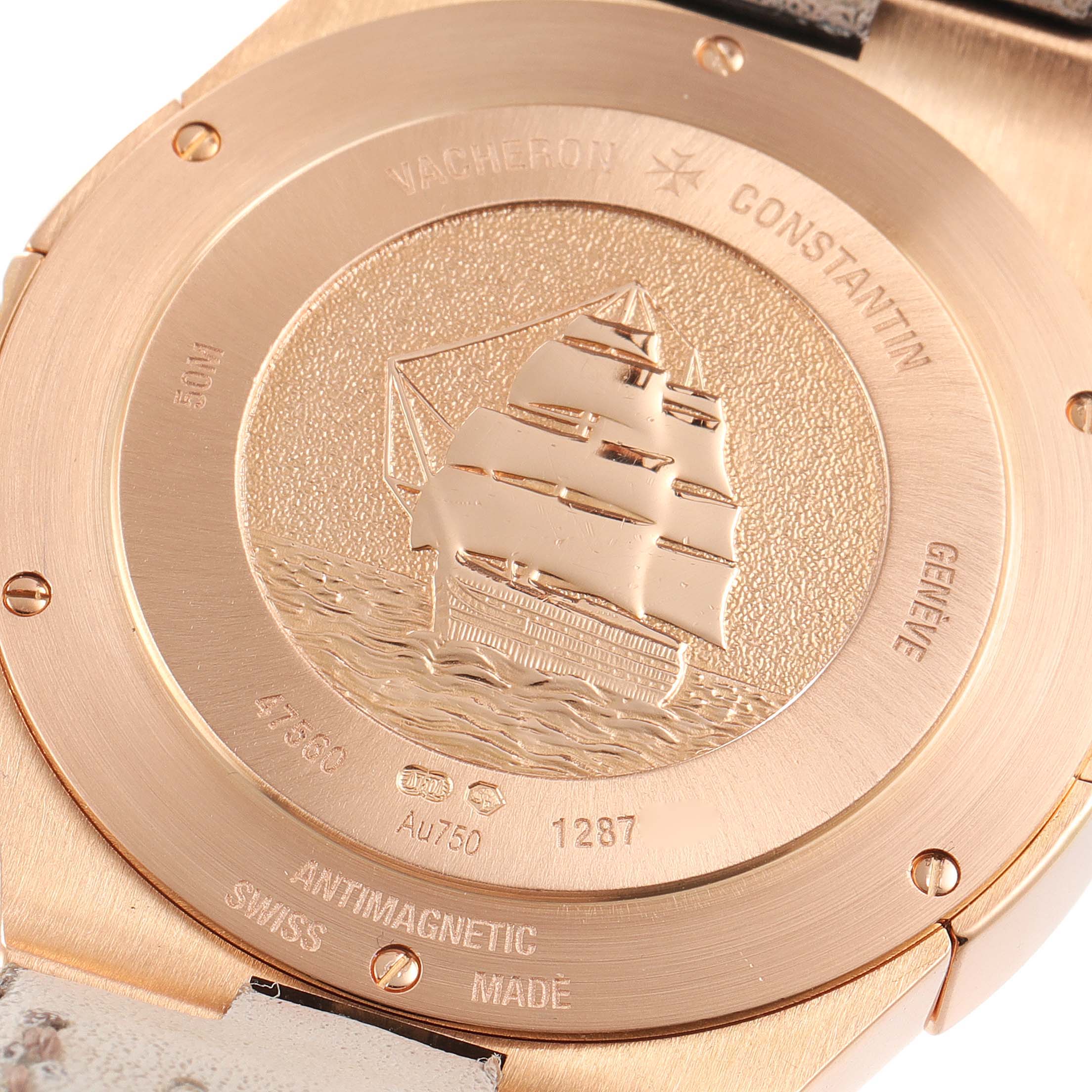The image shows the back case of a Vacheron Constantin Overseas 47560/000R-9672 Women's Rose Gold Silver Dial 47560/000R-9672 Women's Rose Gold Silver Dial watch, featuring an engraved ship and various inscriptions.