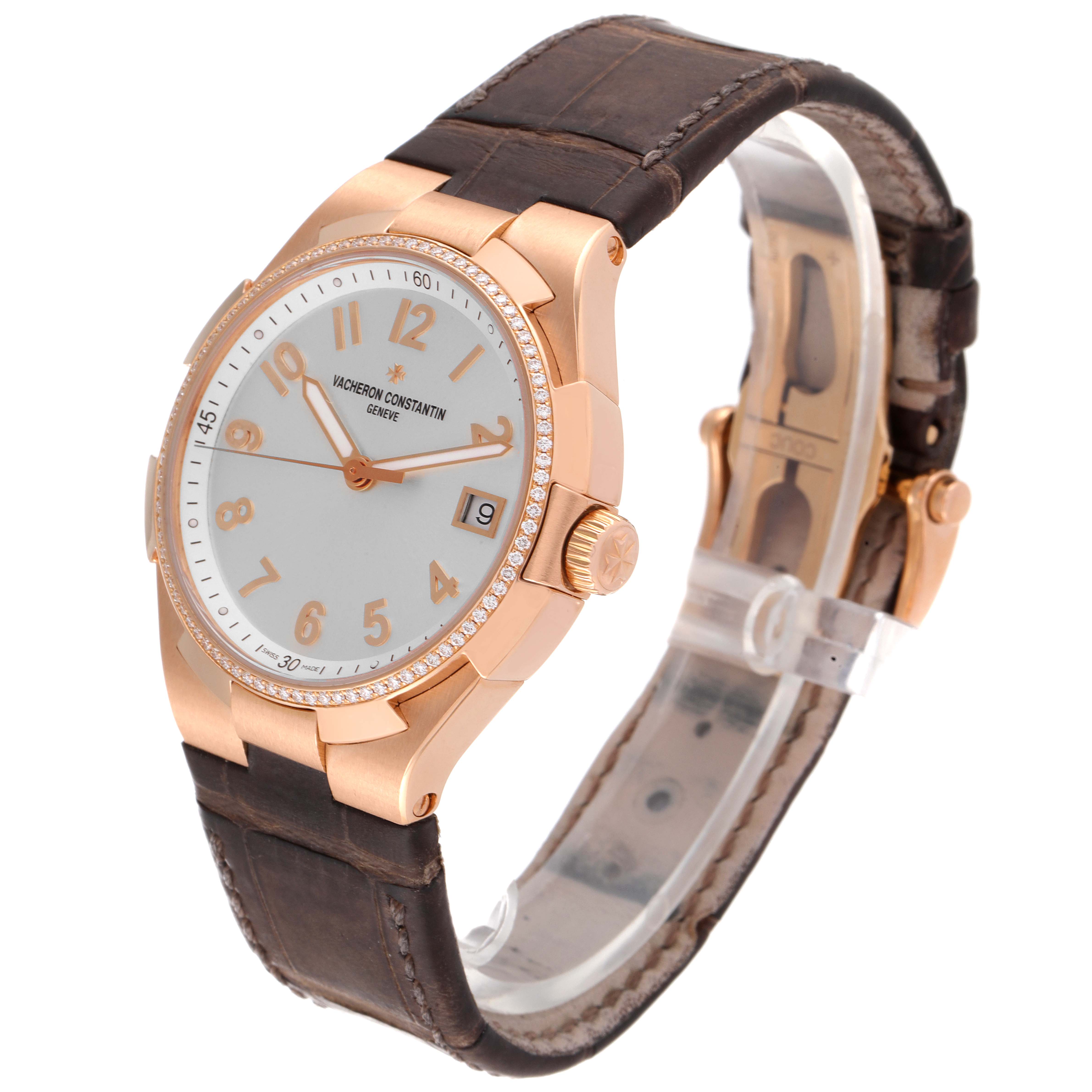 The Vacheron Constantin Overseas 47560/000R-9672 Women's Rose Gold Silver Dial 47560/000R-9672 Women's Rose Gold Silver Dial watch is shown at a three-quarter angle, highlighting the dial, bezel, crown, and part of the strap.