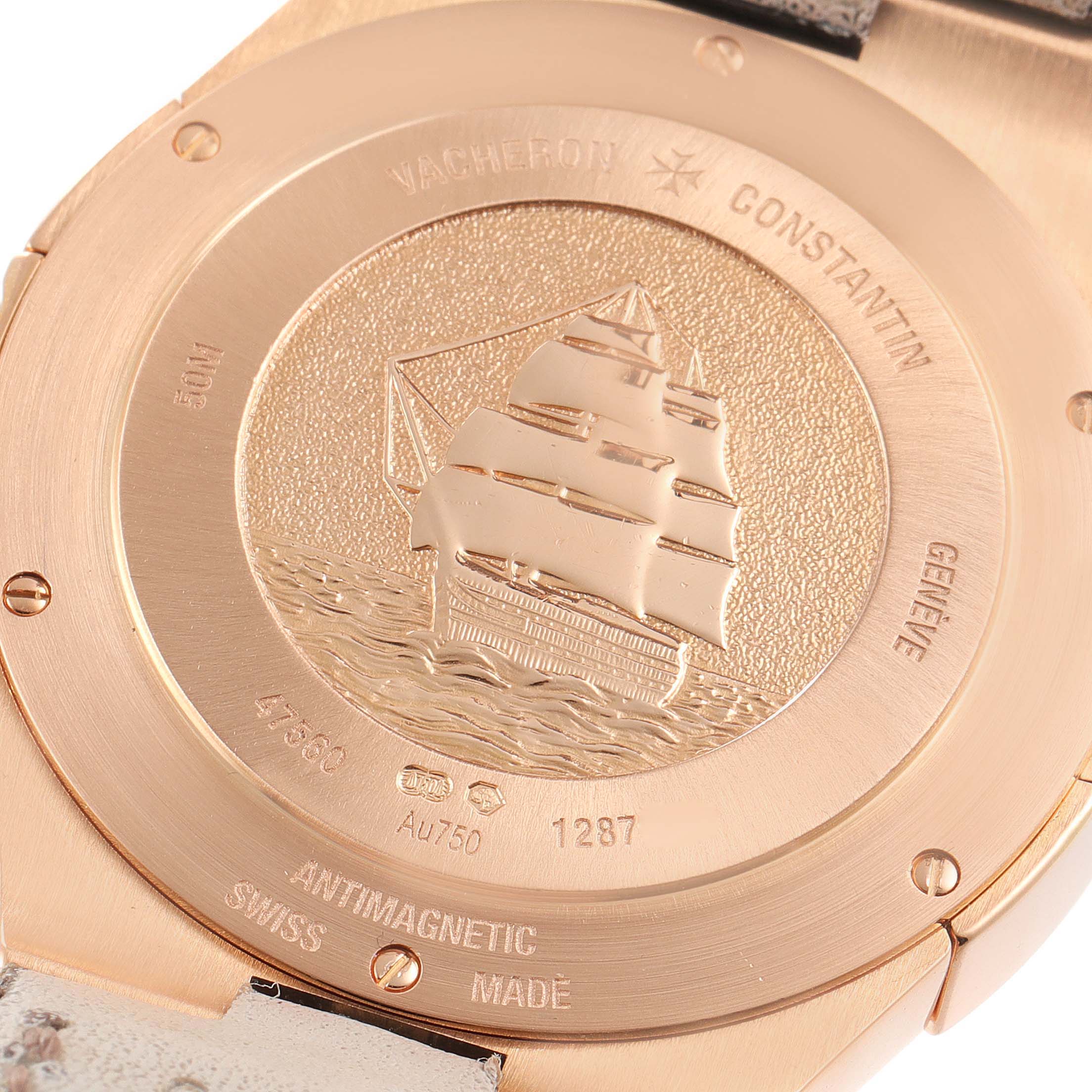 The image shows the case back of a Vacheron Constantin Overseas 47560/000R-9672 Women's Rose Gold Silver Dial watch with an engraved ship design.