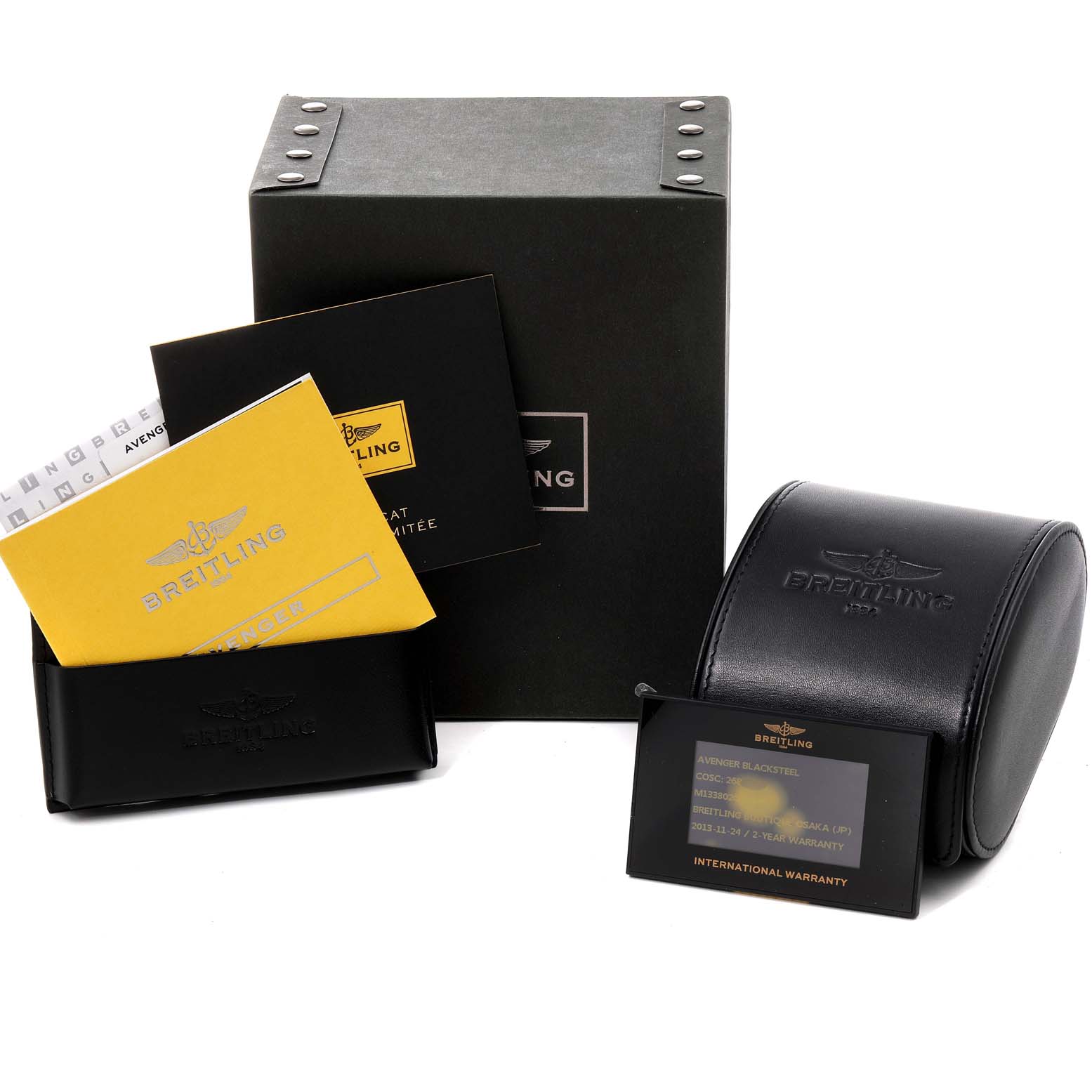 The image displays the packaging and accessories of a Breitling Avenger M13380 Men
s Stainless Steel Black Dial M13380 Men
s Stainless Steel Black Dial watch, including the box, case, manuals, and warranty card.