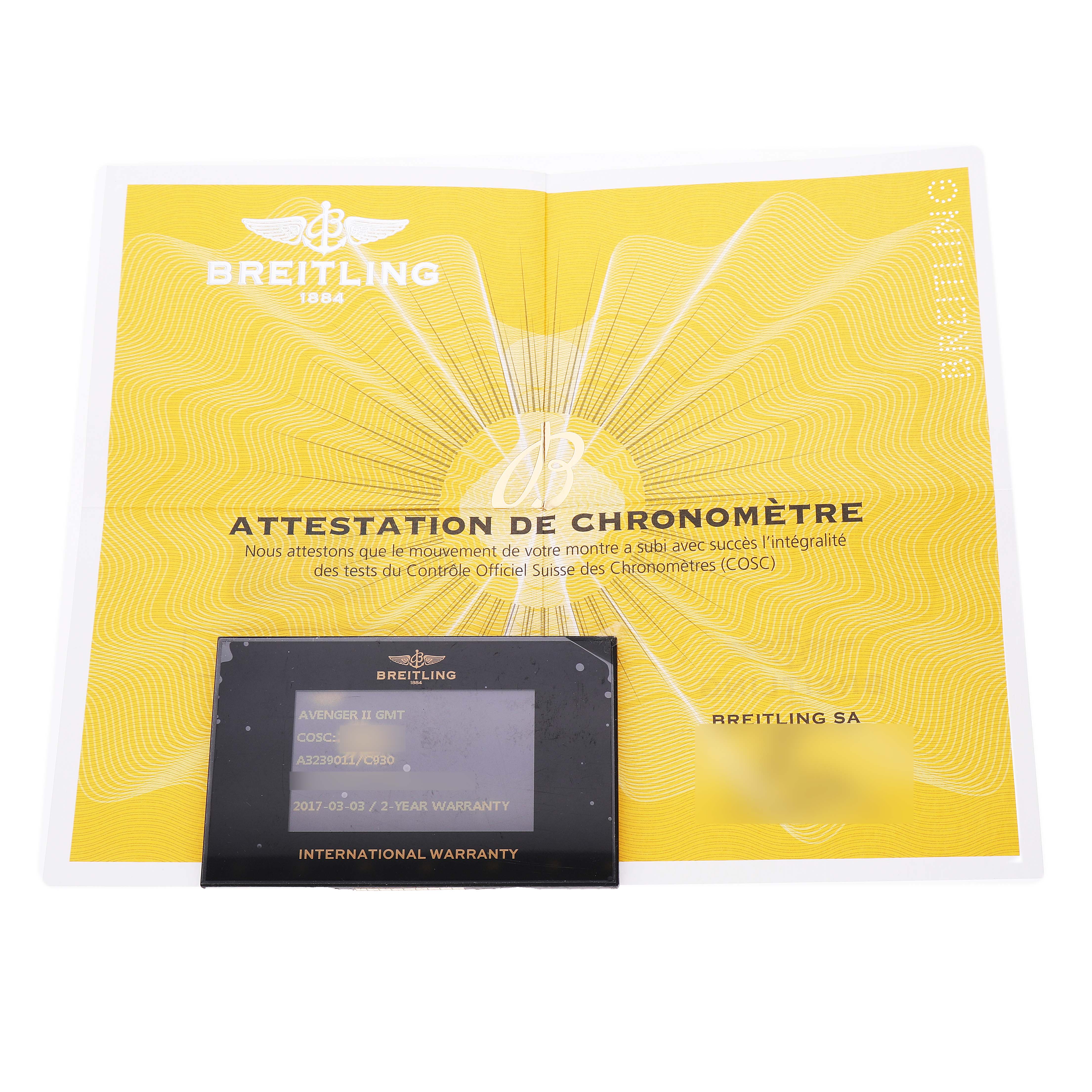 The image shows a Breitling Avenger A3239011/C930 Men's Stainless Steel Blue Dial model's international warranty card and COSC certification document.