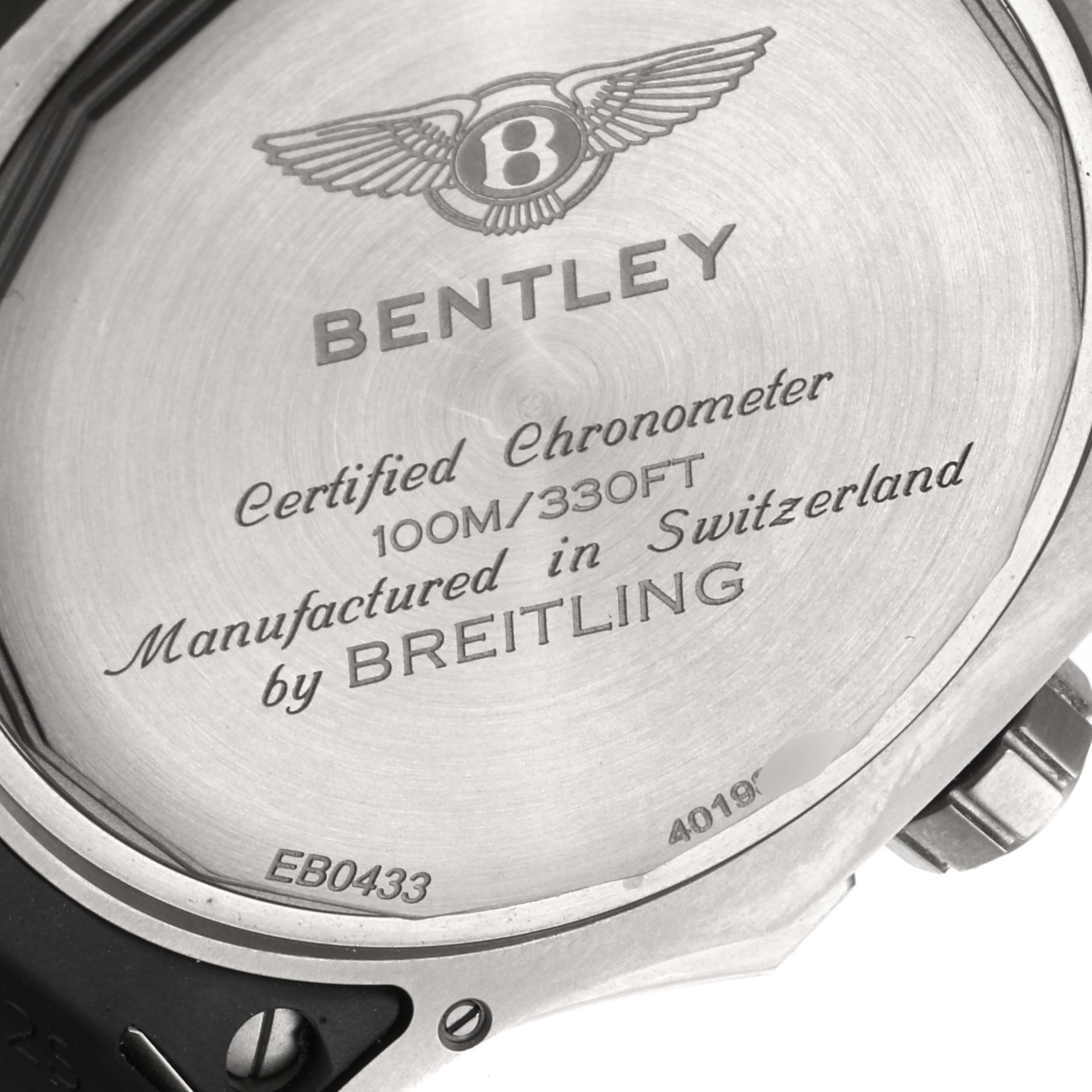 The image shows the case back of a Breitling Bentley EB0433 Men's Titanium Black Dial EB0433 Men's Titanium Black Dial watch with engraved details and a partial view of the crown.
